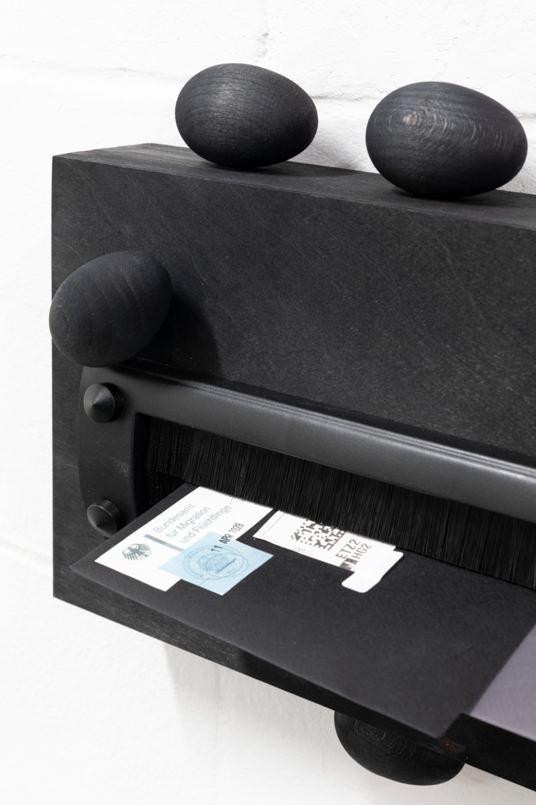 Yeşim Akdeniz, Walking on Eggshells #6 (detail), (2025). Wood, metal, letters, 40x25cm.