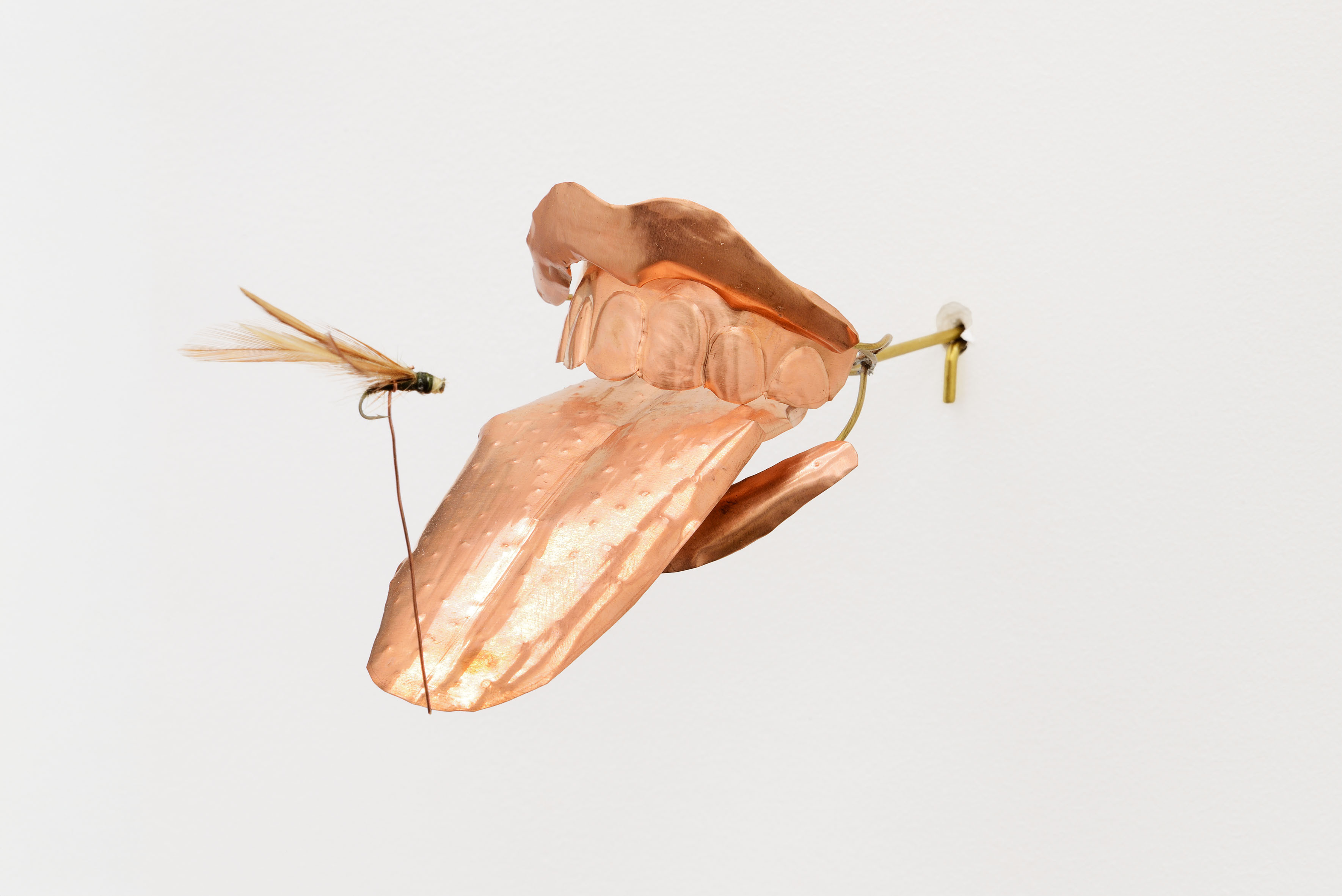 Blanca Gracia, En boca cerrada no entran moscas, 2025, hand-embossed copper and brass plates and rods, lacquered and soldered with tin and silver, 8 x 6 x 15 cm. Photo by Roberto Apa. Courtesy of ADA, Rome