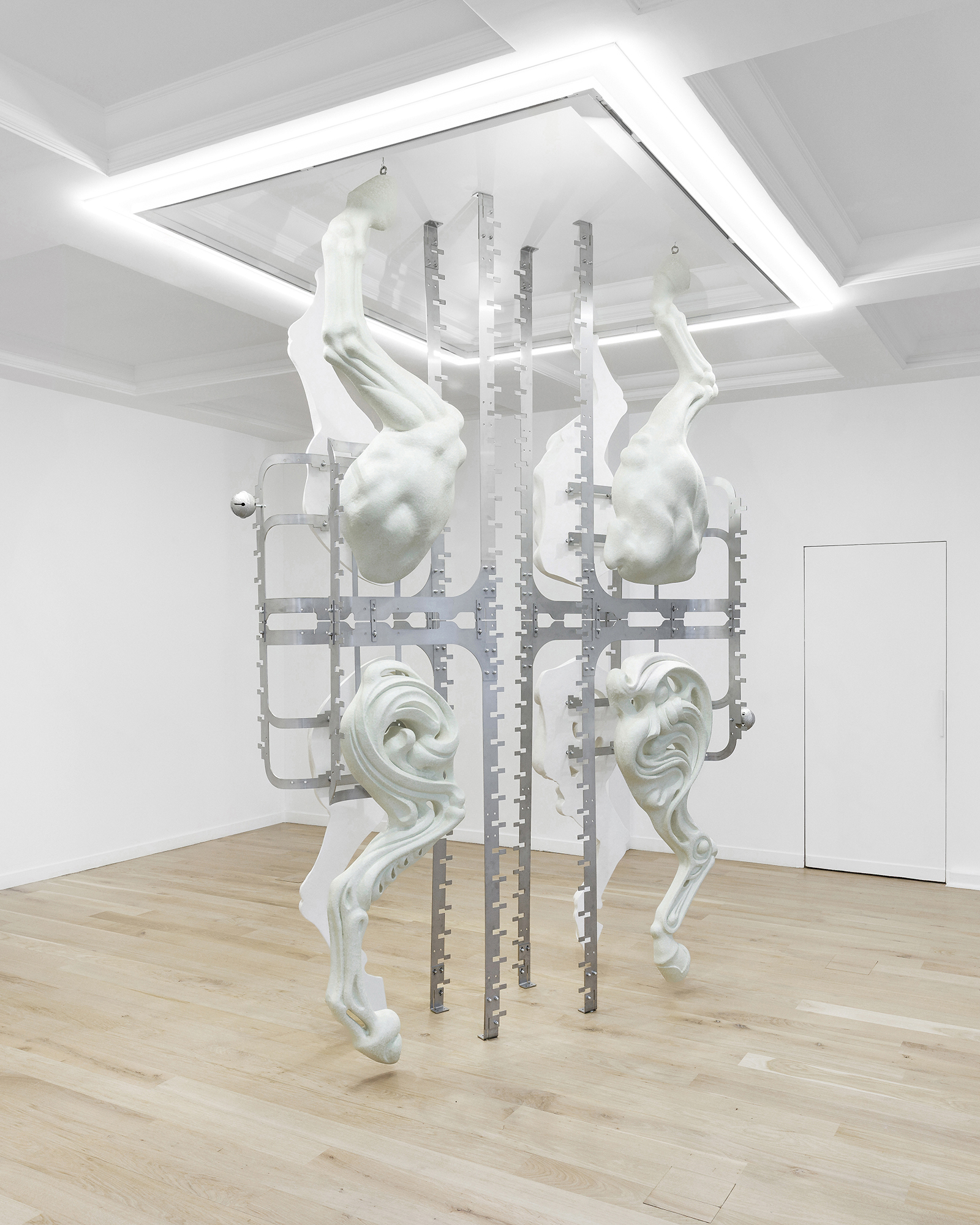 Midway Kin, 2025, hand-sculpted - acrylic plaster, fibers, pigments, stainless steel, tin bells, installation view