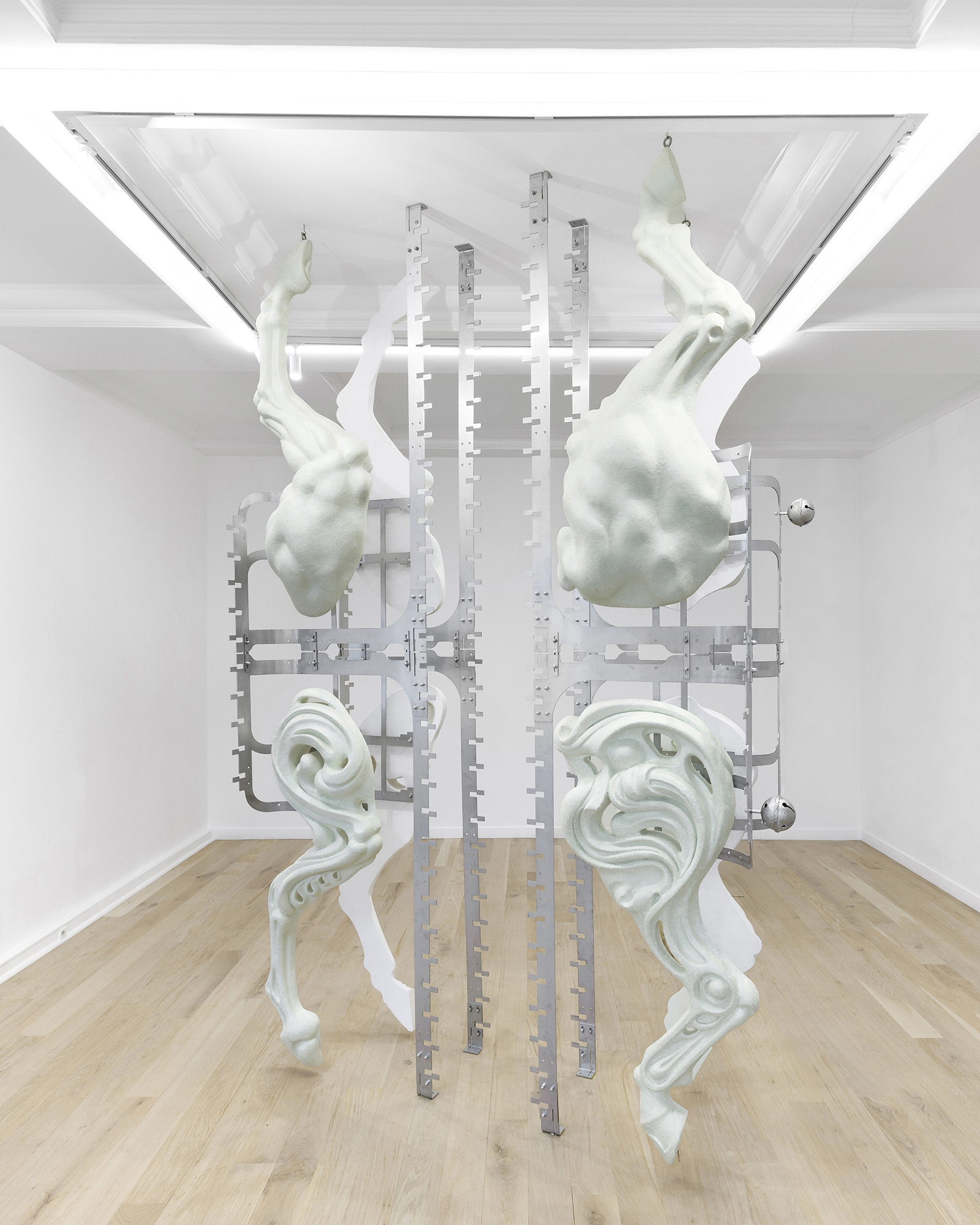 Midway Kin, 2025, hand-sculpted - acrylic plaster, fibers, pigments, stainless steel, tin bells, installation view