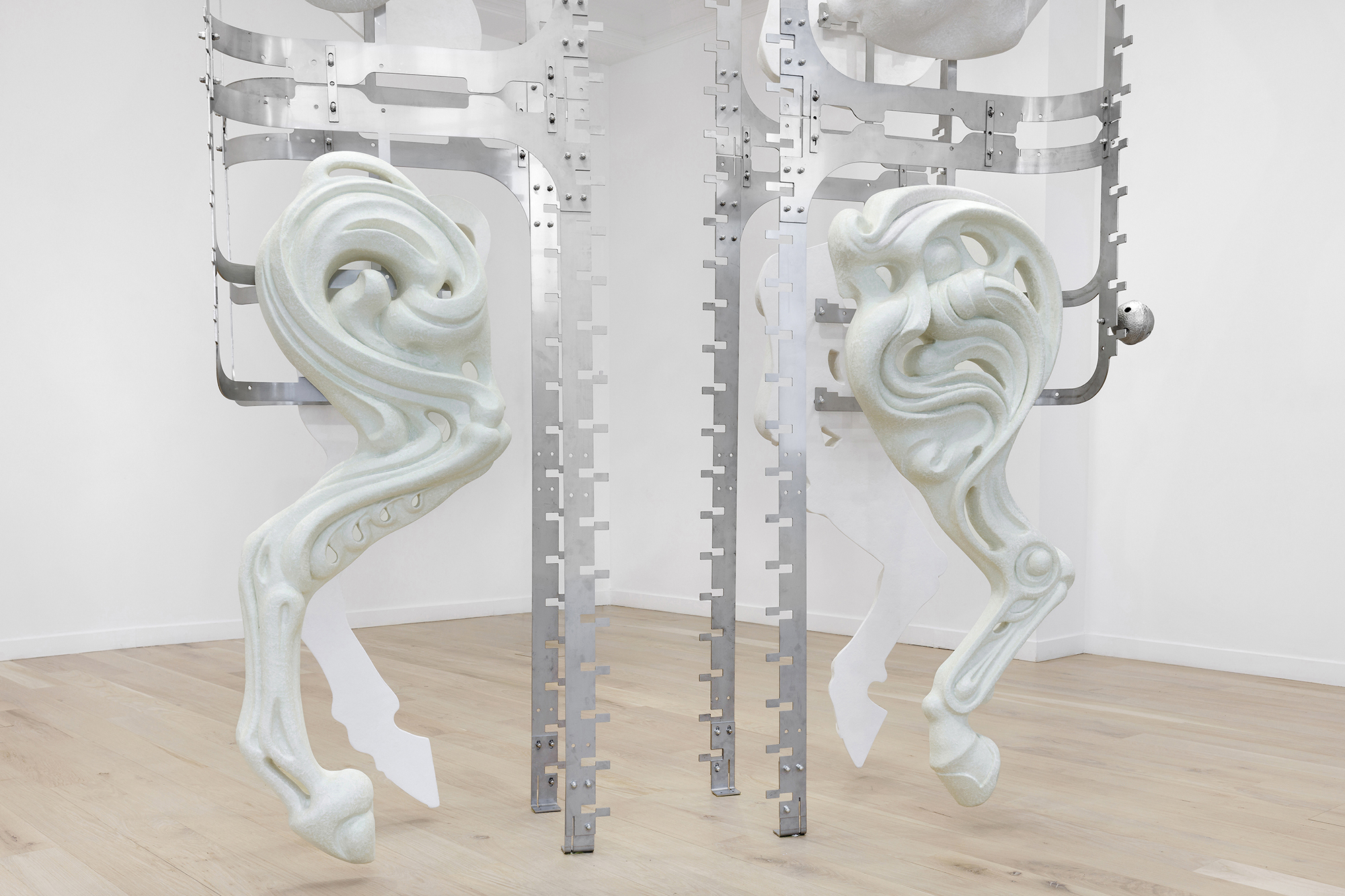 Midway Kin, 2025, hand-sculpted - acrylic plaster, fibers, pigments, stainless steel, tin bells, installation view