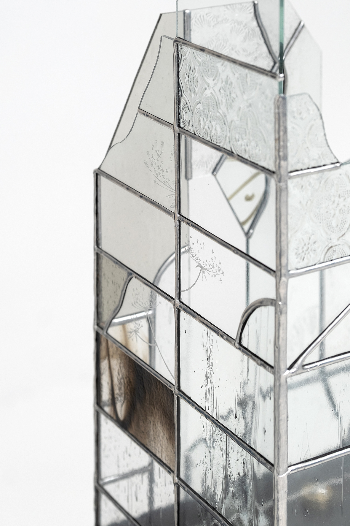 Anna Mari Liivrand. Echo of Shards. Wrought iron, stained glass, antique glass, found factory glass, tin, cork caps, coins, buttons, stone, nuts, 2025 Photo Albert Kerstna. Detail