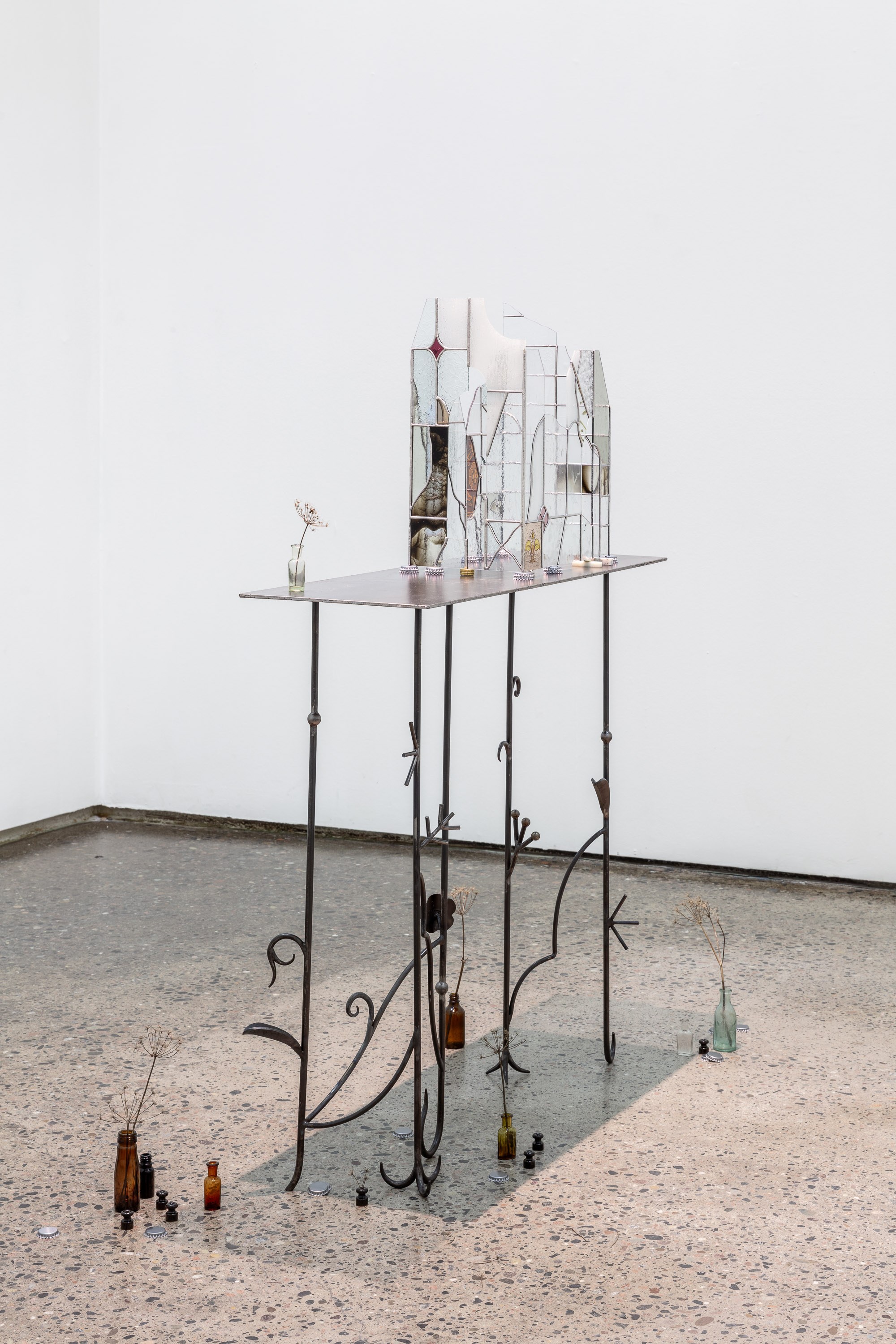 Anna Mari Liivrand. Echo of Shards. Wrought iron, stained glass, antique glass, found factory glass, tin, cork caps, coins, buttons, stone, nuts, 2025 Photo Tor Simen Ulstein