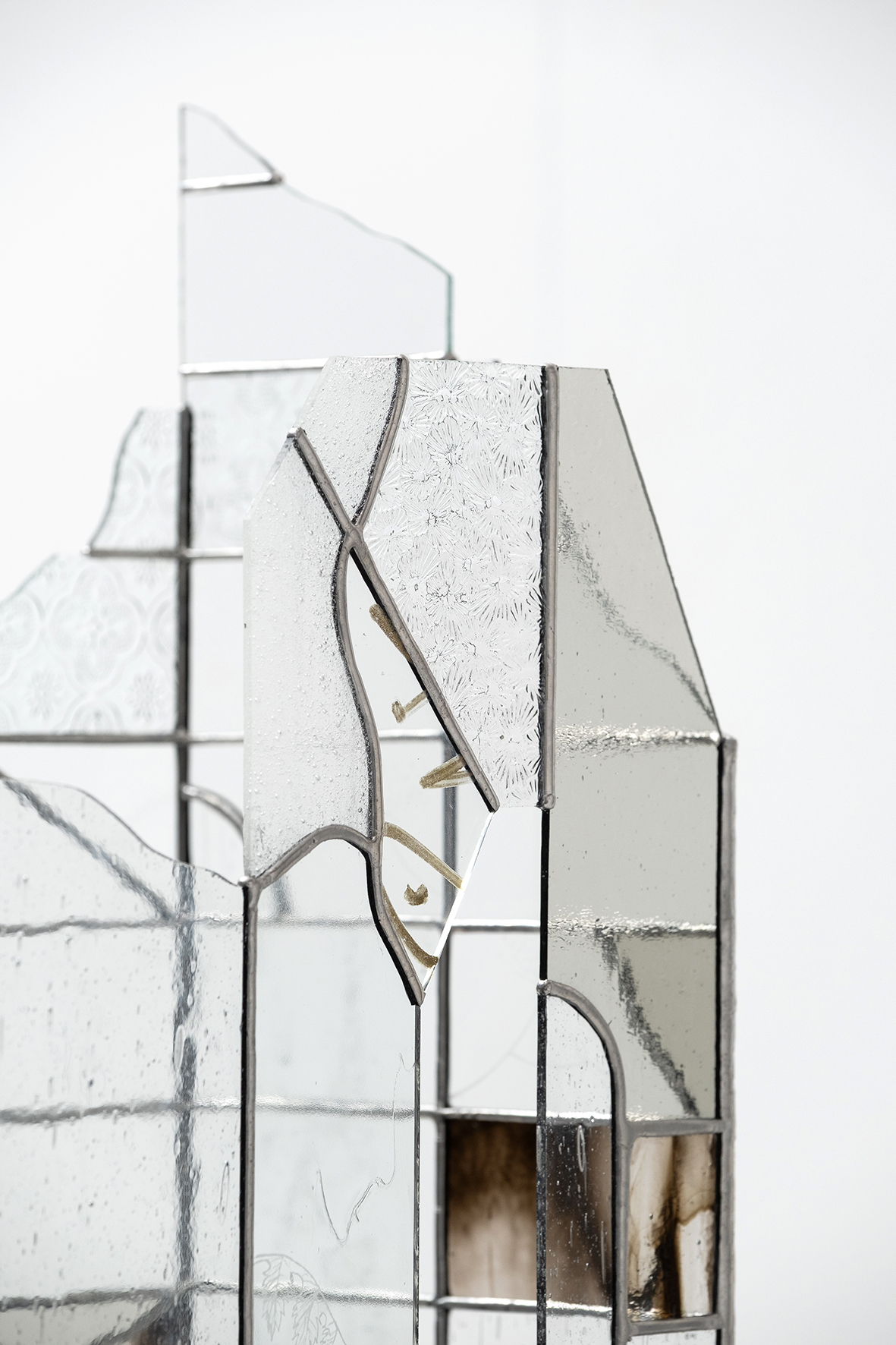 Anna Mari Liivrand. Echo of Shards. Wrought iron, stained glass, antique glass, found factory glass, tin, cork caps, coins, buttons, stone, nuts, 2025 Photo Albert Kerstna. Detail