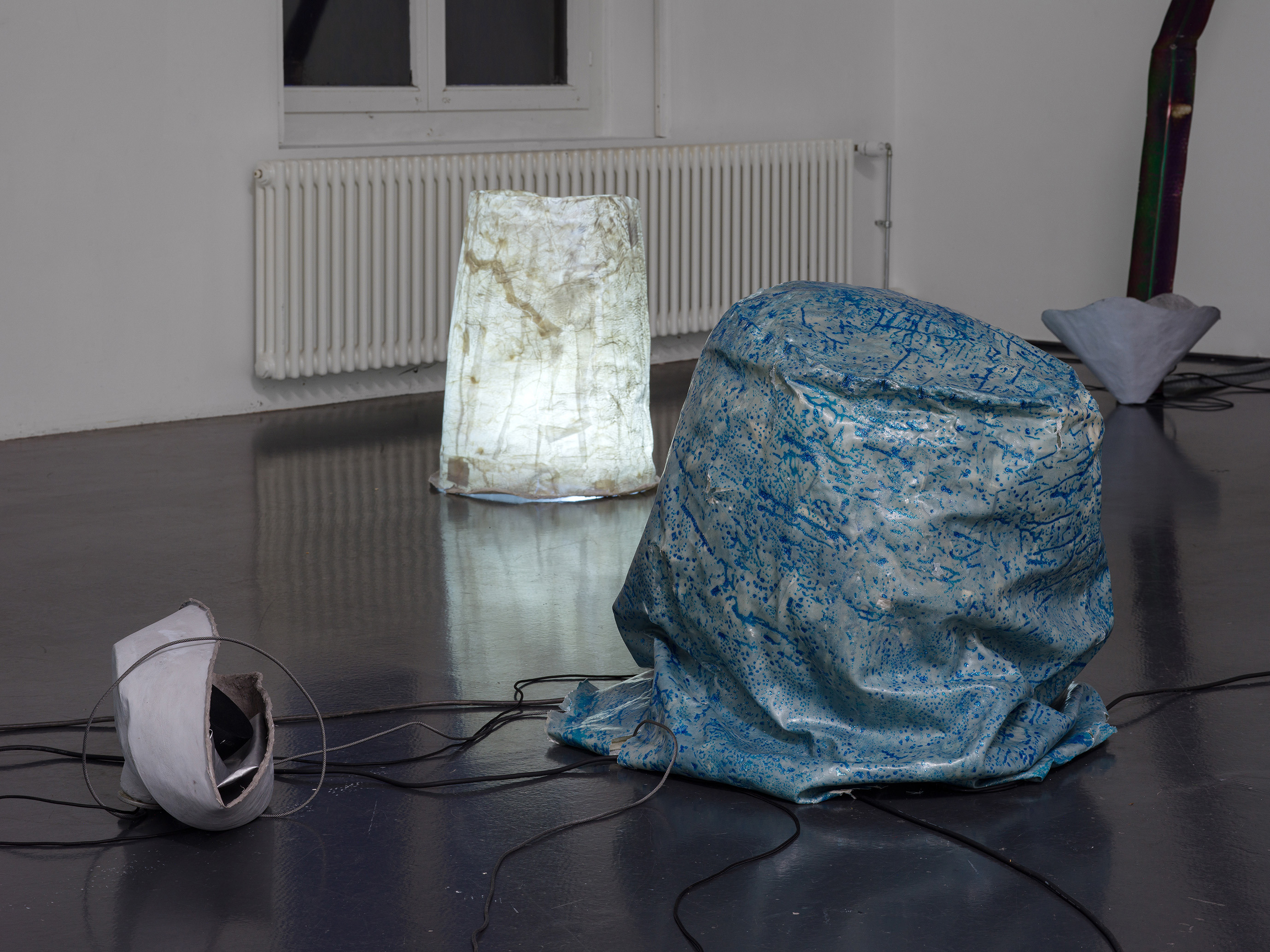  Julia Znoj, dereal cat perspective, 2025, Sound piece 36:48, sound system, soft speakers, bluetooth speakers, subwoover, paper, glue, paint, LED lights, dimensions variable