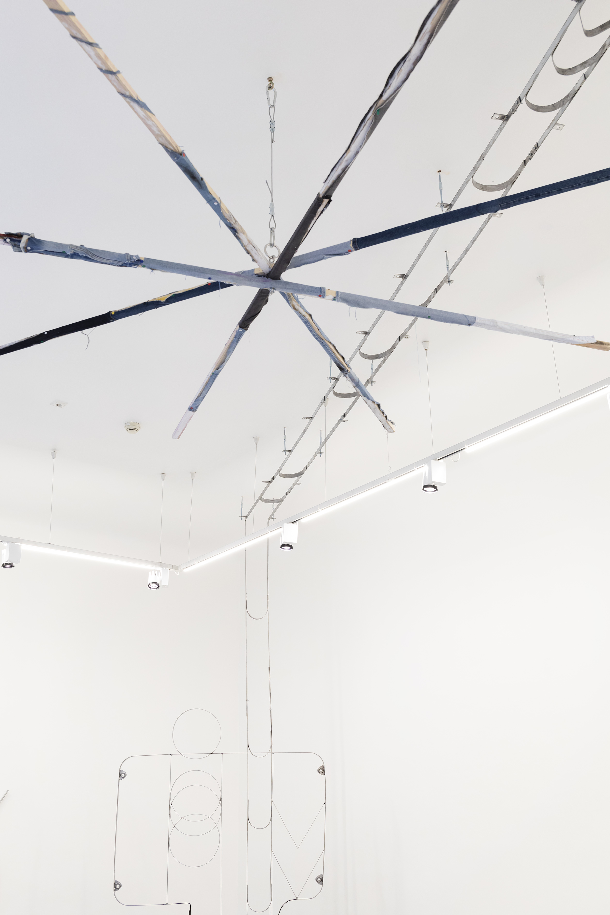 Lehtomaa: "iiii" / denim, plywood, pin, oil paint, wax pencil, cotton, charcoal, threaded rod, wire, carabiner, cable lock, Vehviläinen: 1Up