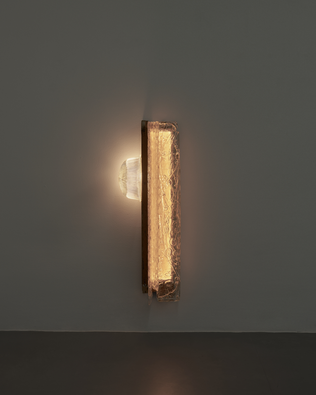 Yes, but not so rapidly, 2025, melted doorsteps, melted cupping glass and melted perfume bottles, street lamp shade, light, 96,5x31x34 cm