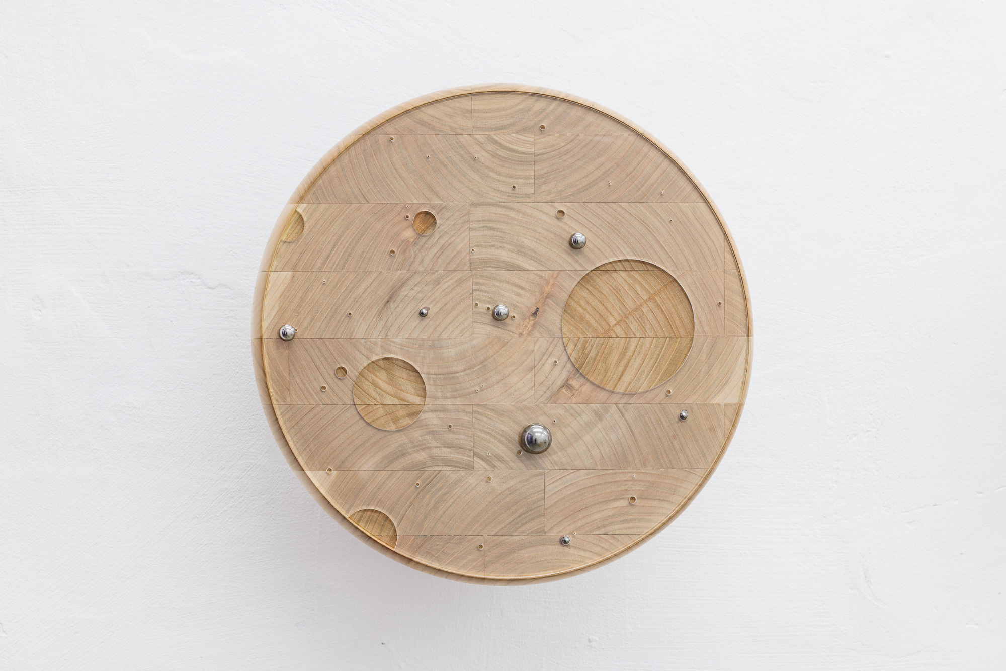 image: work / title and year: a wanderer, 2025 / material: cherry wood, acrylic glass, magnets / dimensions: 32 x 18 cm