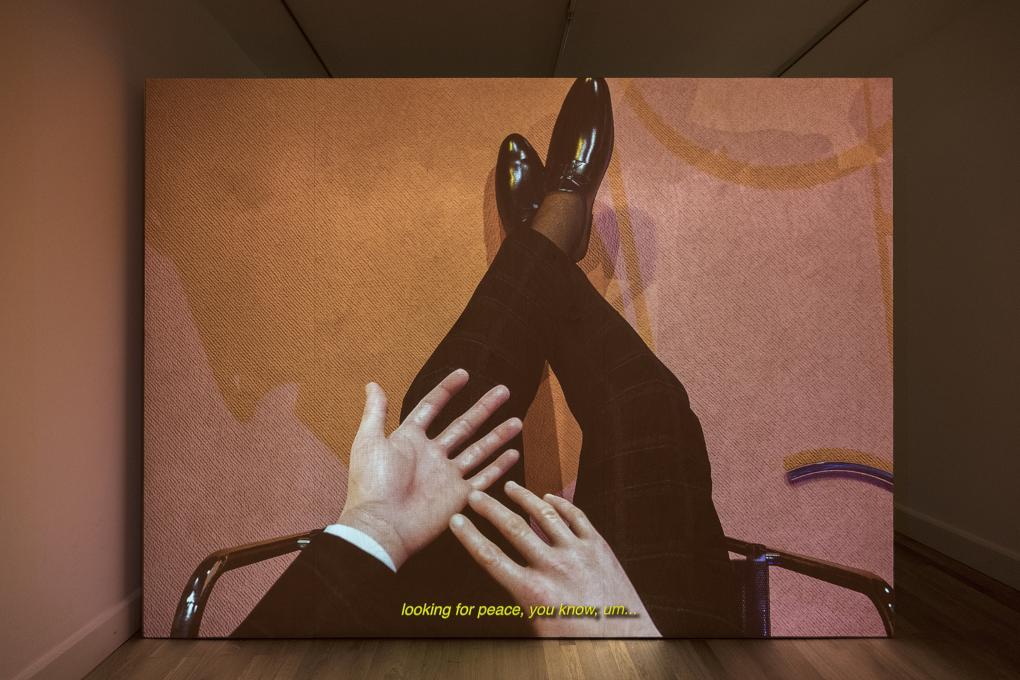 Exhibition view: Ed Atkins, The worm (installation), 2021, Video projection with sound, loop, beech plywood, Variable dimensions