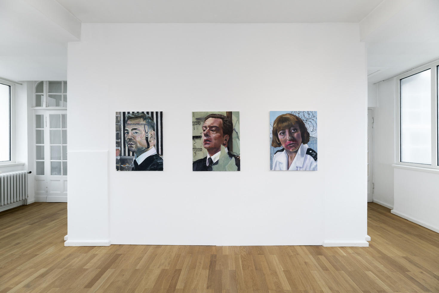 Exhibition view, from left to right: Bod Mellor, Prison Officer Eric McNally (Stephen Graham), 2024; Wing Governor Jim Fenner (Jack Ellis), 2024; Prison Officer Diane Baker (Tracey Wilkinson), 2024; Oil on linen, 76.2 x 61 x 1.5 cm 