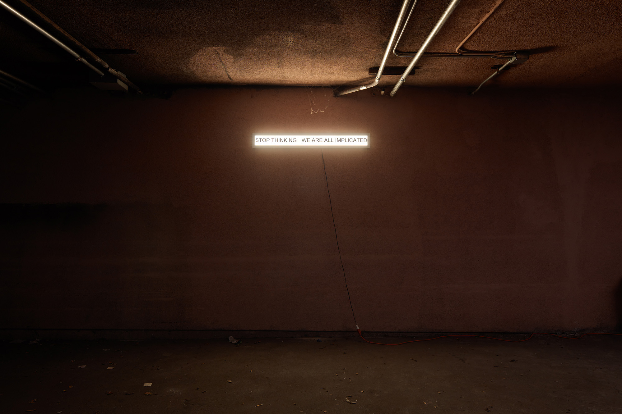 Joseph Klahr - STOP THINKING WE ARE ALL IMPLICATED LED fixture, vinyl 5 x 48 inches 2025