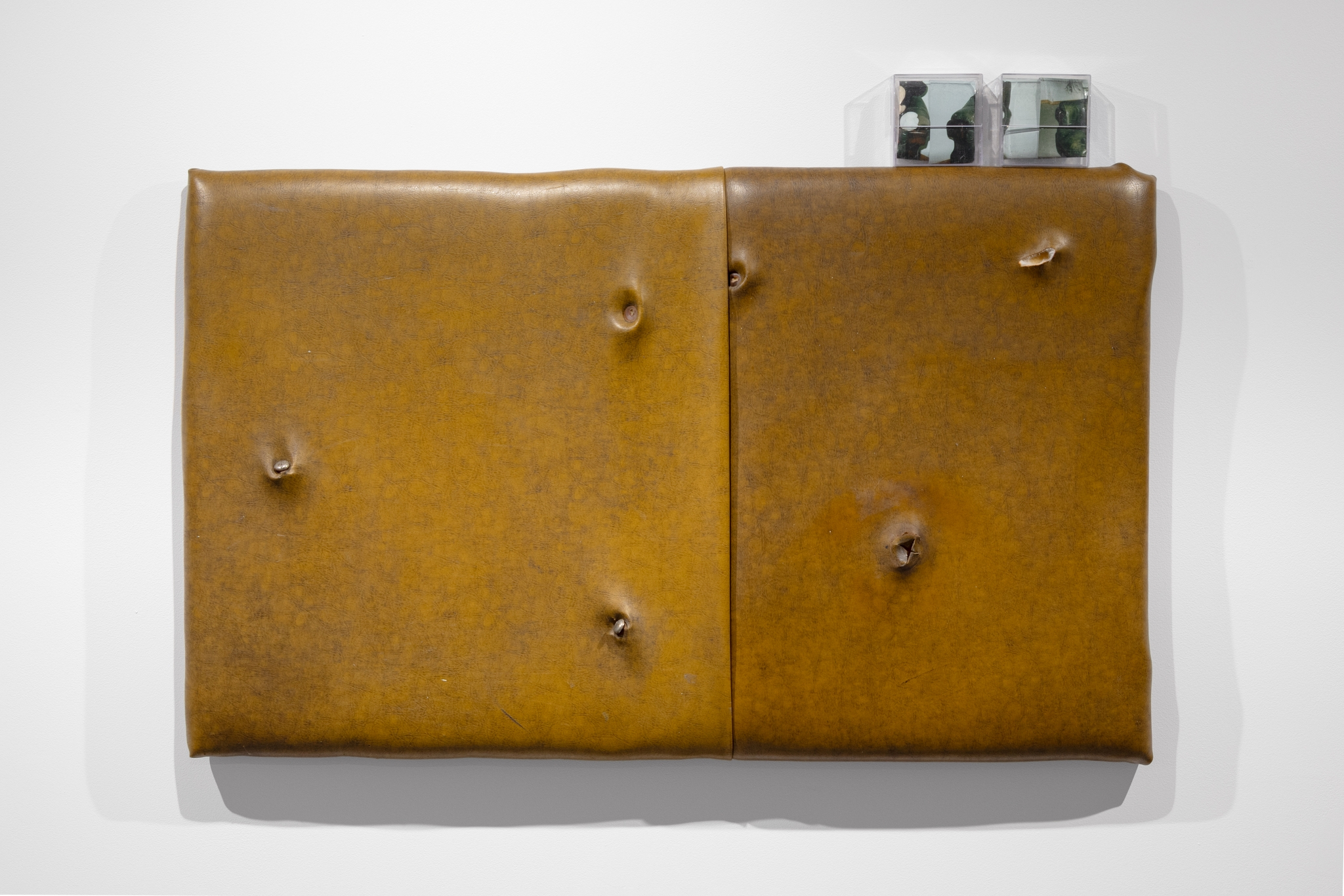 Marta Sundmann, „Skin 4”, 2025, mixed media, wood, sponge, door leather, memory-carrier boxes, photographic print, 67.5 × 110 cm