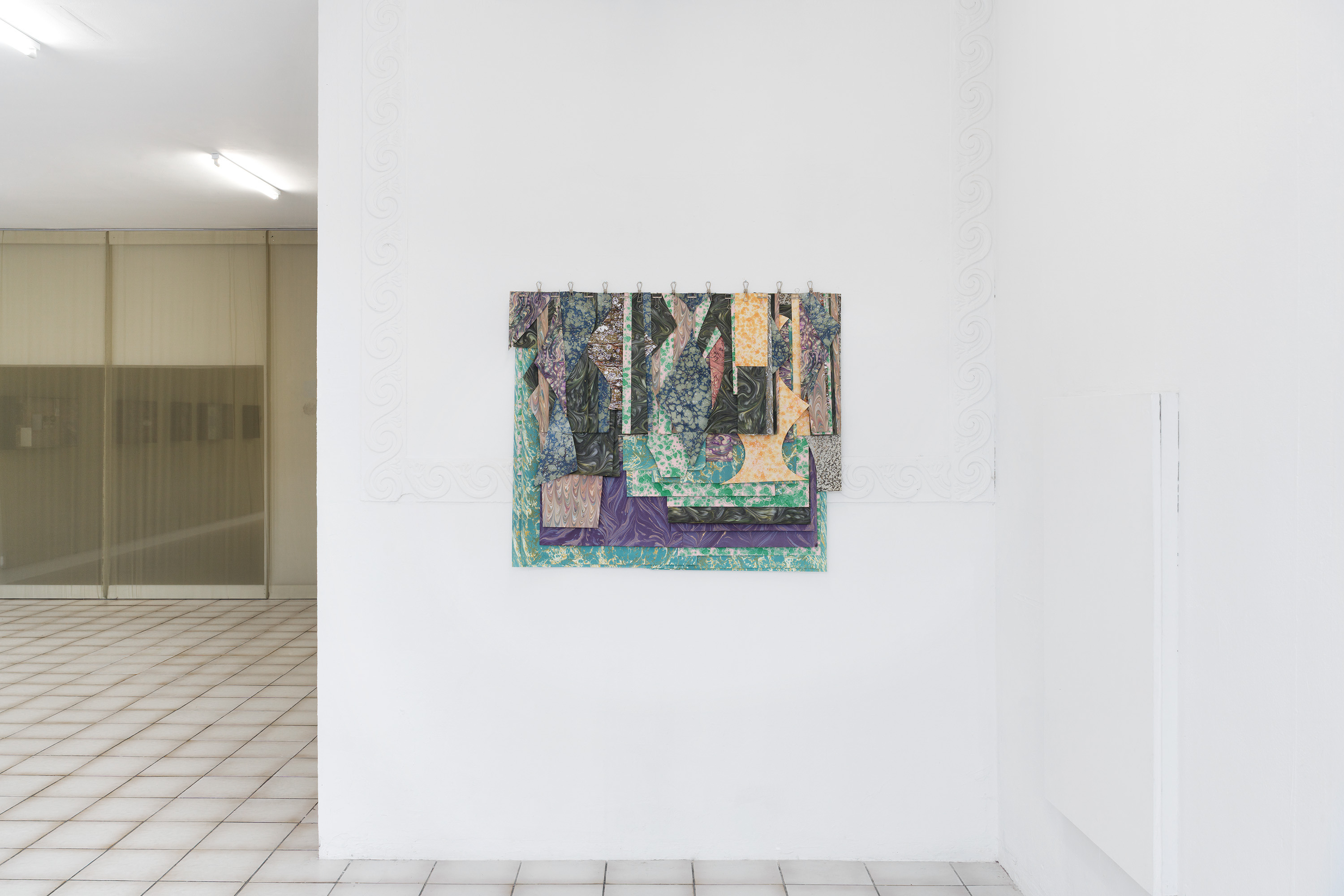 Marbrés, 2025, Marbled paper, clips, 112x98 cm. they built up the picture by Caroline Reveillaud, 16.01-28.02.26, at Komplot, Brussels. Image Lola Pertsowsky  