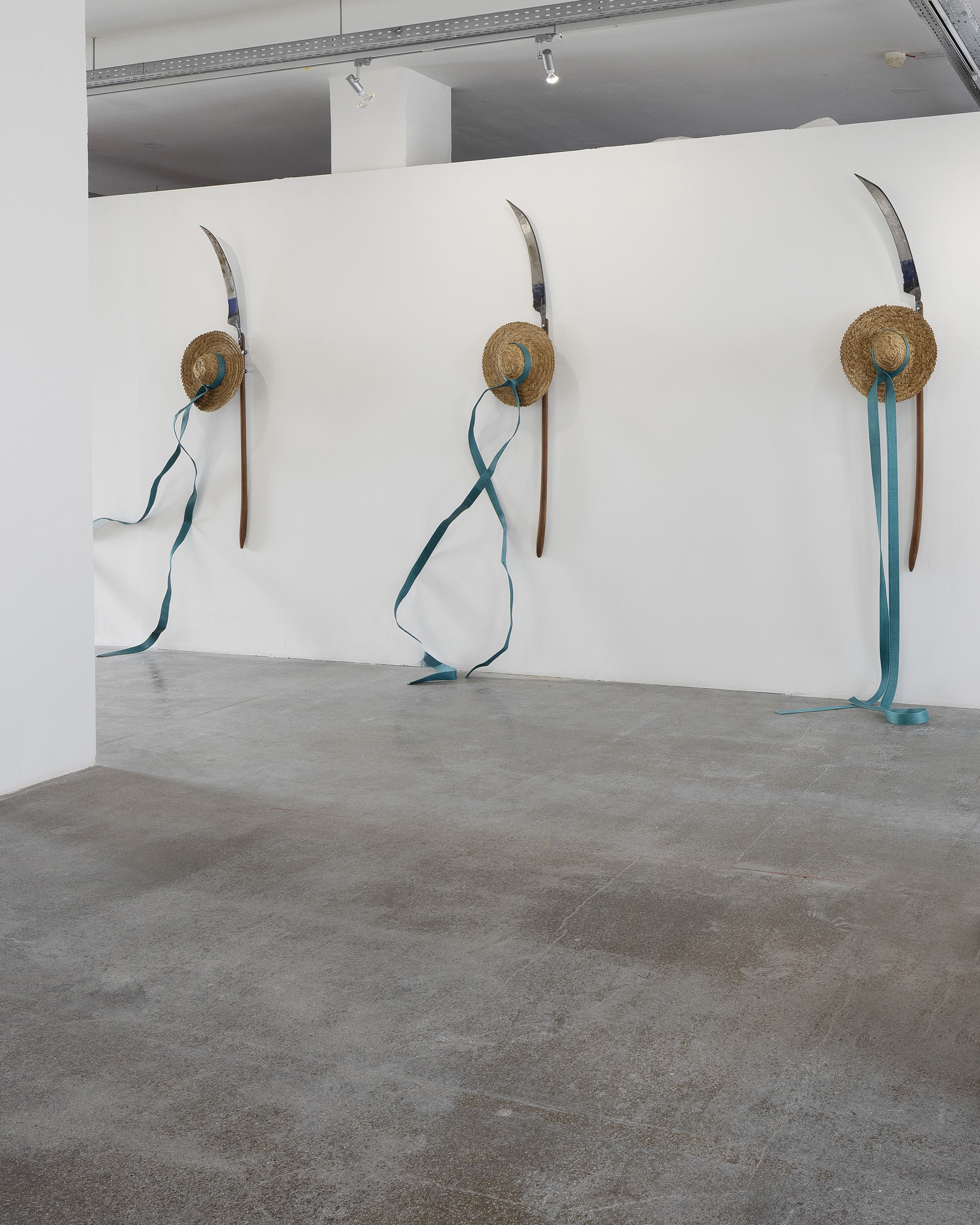 Uladzimir Hramovich, Rebellious Things (New Wind), 2021 Scythe, straw hat, lashing strap Dimensions variable