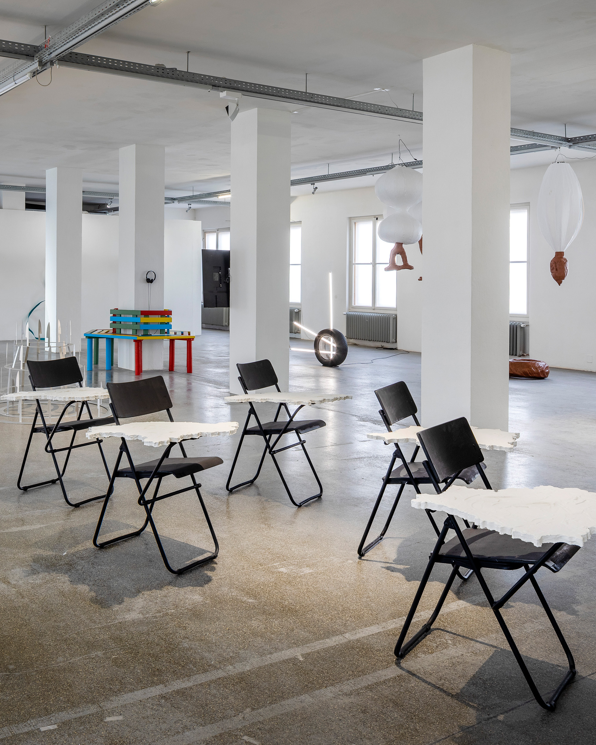 Lesia Pcholka, TRY TO READ MY STONES, 2023–2026 7 chairs, XPS boards, plaster Dimensions variable