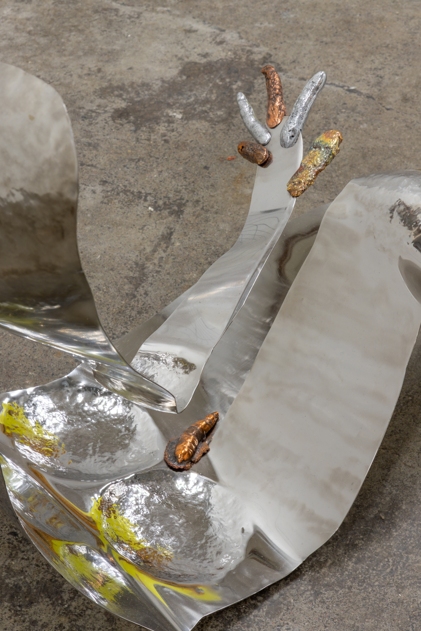 Matti Sumari: Renki (the farmhand), 2023, stainless steel (from an illegal catering operation), Nordic Gold alloy, aluminium, copper, slag stone, cast from found metal, 100 x 160 x 60 cm