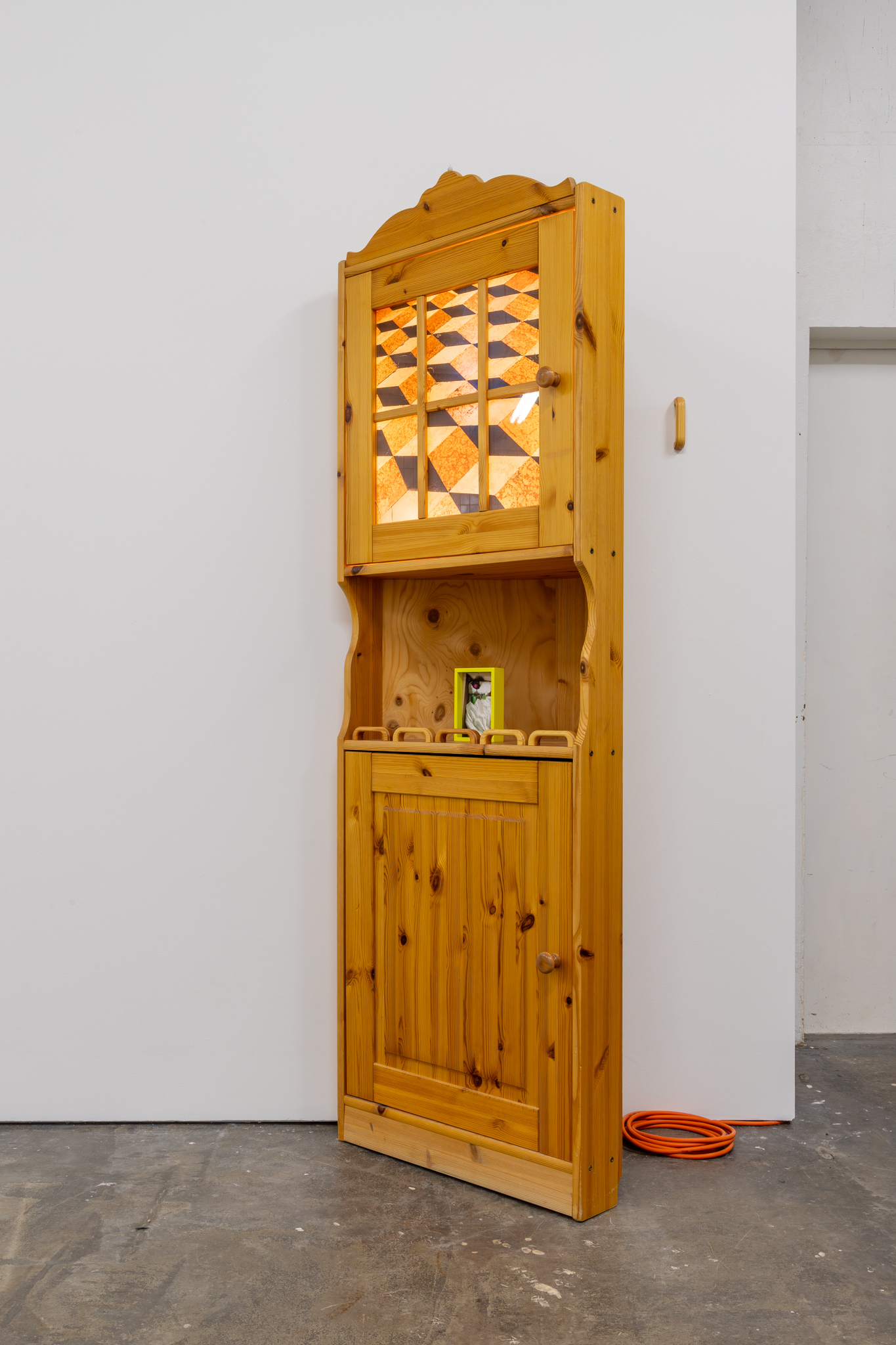 Hertta Kiiski & Janne Punkari: Valokaappi (Lightbox), 2025, cabinet, pigment print on reflective film, LED lights, handles, pigment print on aluminium, sulfur-yellow frame with museum glass, 196 x 64 x 41 cm