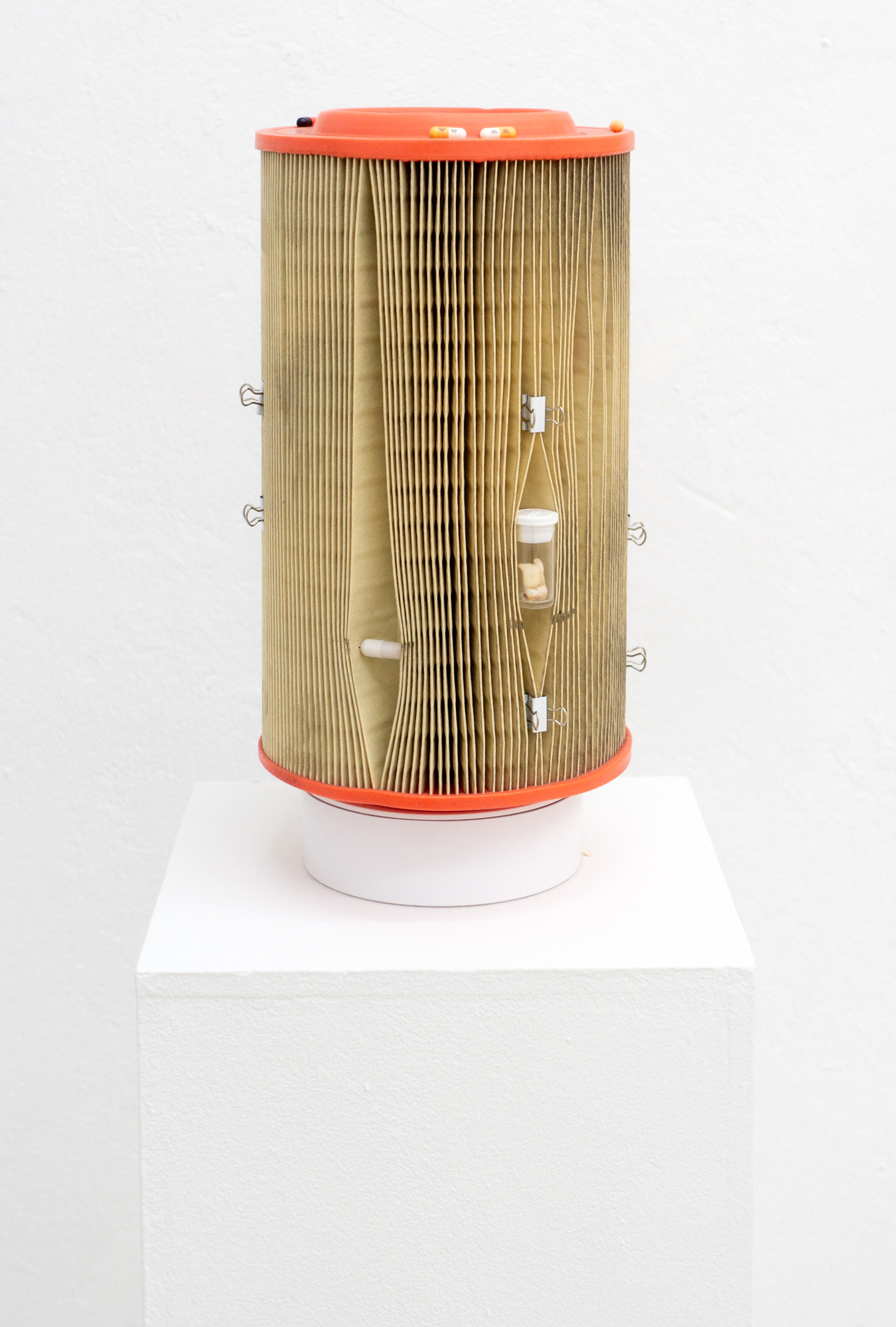 Kurt von Bley · Controlled Suffering · Used air filters, tablets, human teeth, plaster, foldback clips, automatic turntables · ø 17 × 36 cm; with plinth: 30 × 30 × 100 cm · 2025