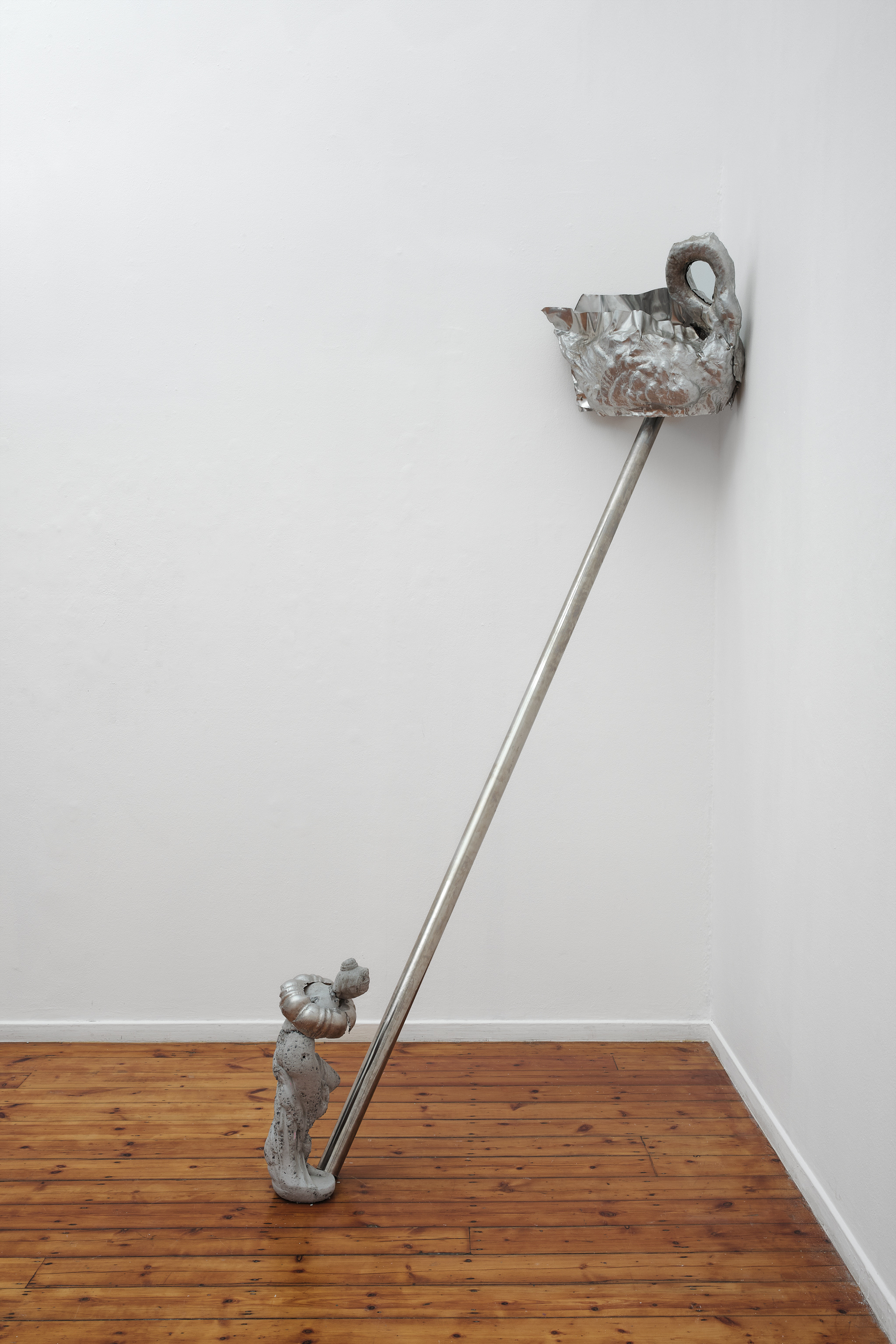 Voltaire and Spinoza (names of childhood geese) 2025 Forged aluminium, stainless steel pipe, cement figure Installed skewered on pipe 250 x 72 x 50 cm 
