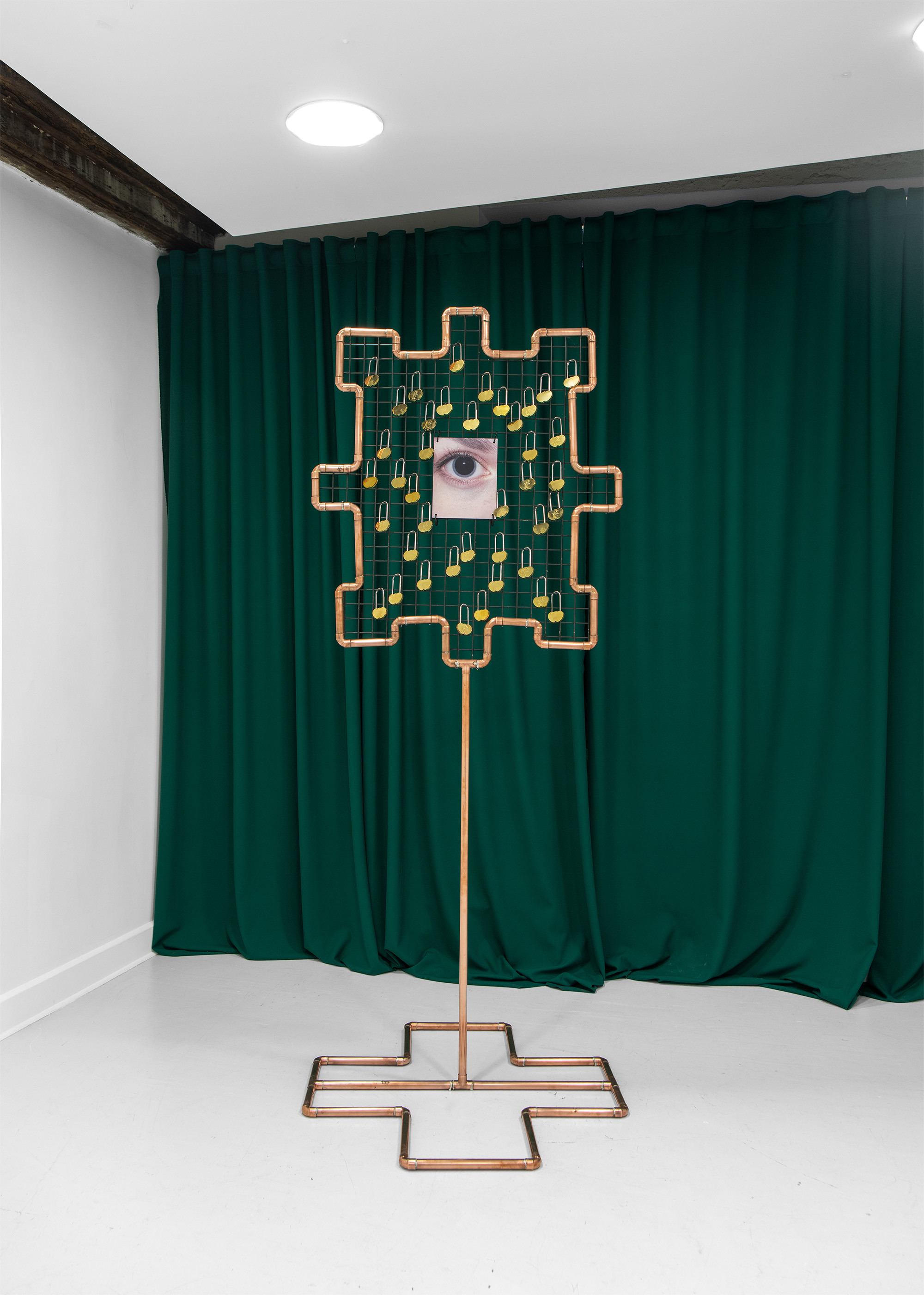 Misha Gudwin, Lock eyes, 2026, 214 x 85 x 85 cm, copper, steel, locks, printing on dibond