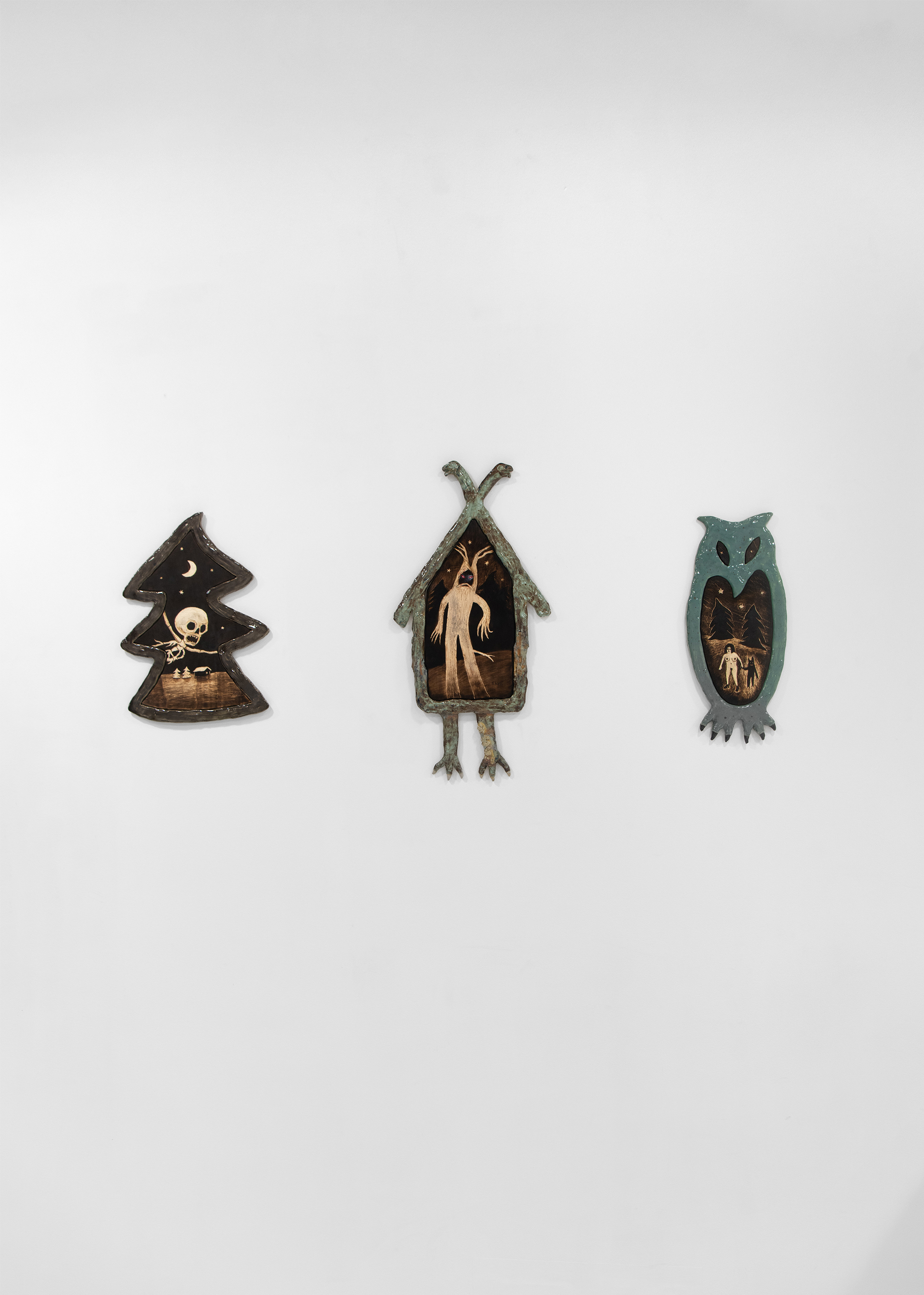 Ivan Volkov, Hollow forest, 2026, Ceramic, glaze, wood, 63 × 31 cm, Lesovik, 2025, Ceramic, glaze, wood, 63 × 31 cm, Owl, 2026, Ceramic, glaze, wood, 63 × 31 cm