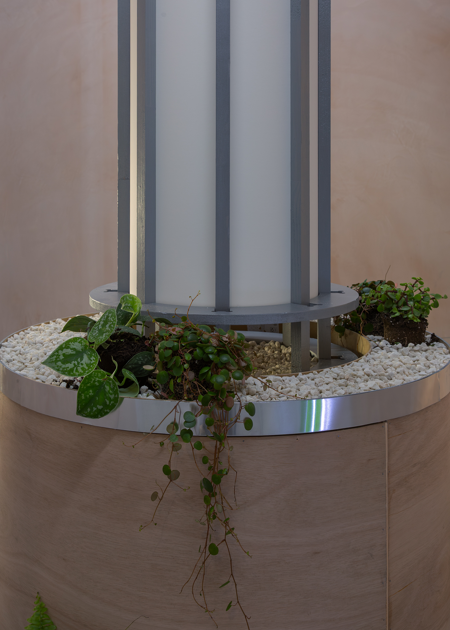 SYNERGYTM Prototype for Atmospheric Regeneration Column , 2026. Plywood, plants, moss, gravel, aluminium, Sound by Nick Rainey. Emma Papworth