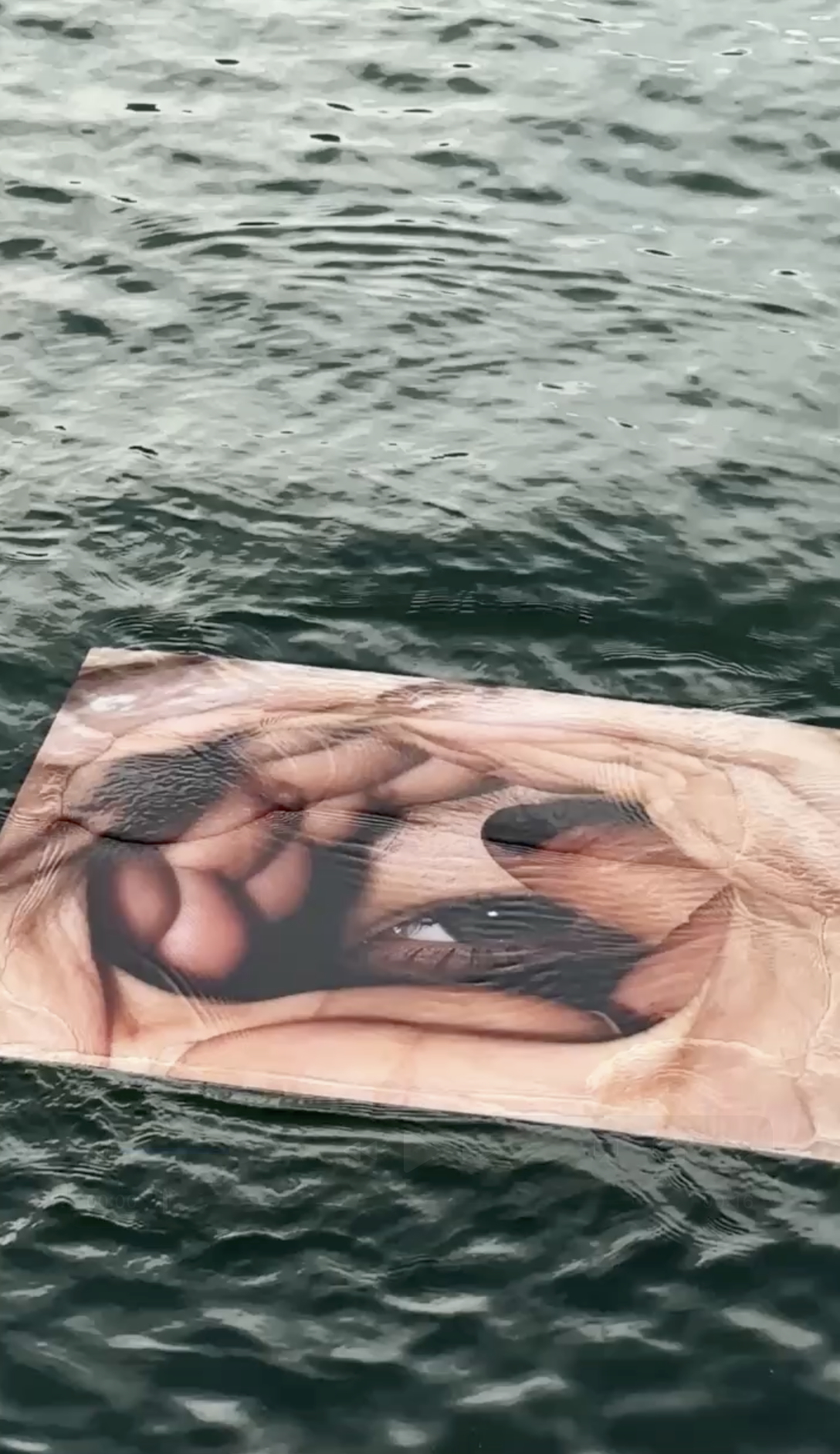 Trust Me — Floating photographic installation at InCadaqués Festival, exploring intimacy, trust, and perception through the interplay of water, light, and movement.