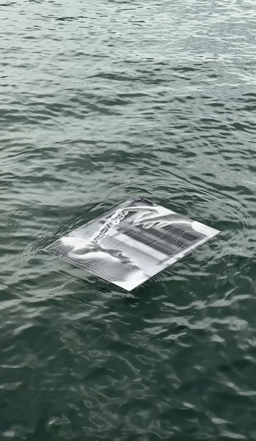 Trust Me — Floating photographic installation at InCadaqués Festival, exploring intimacy, trust, and perception through the interplay of water, light, and movement.