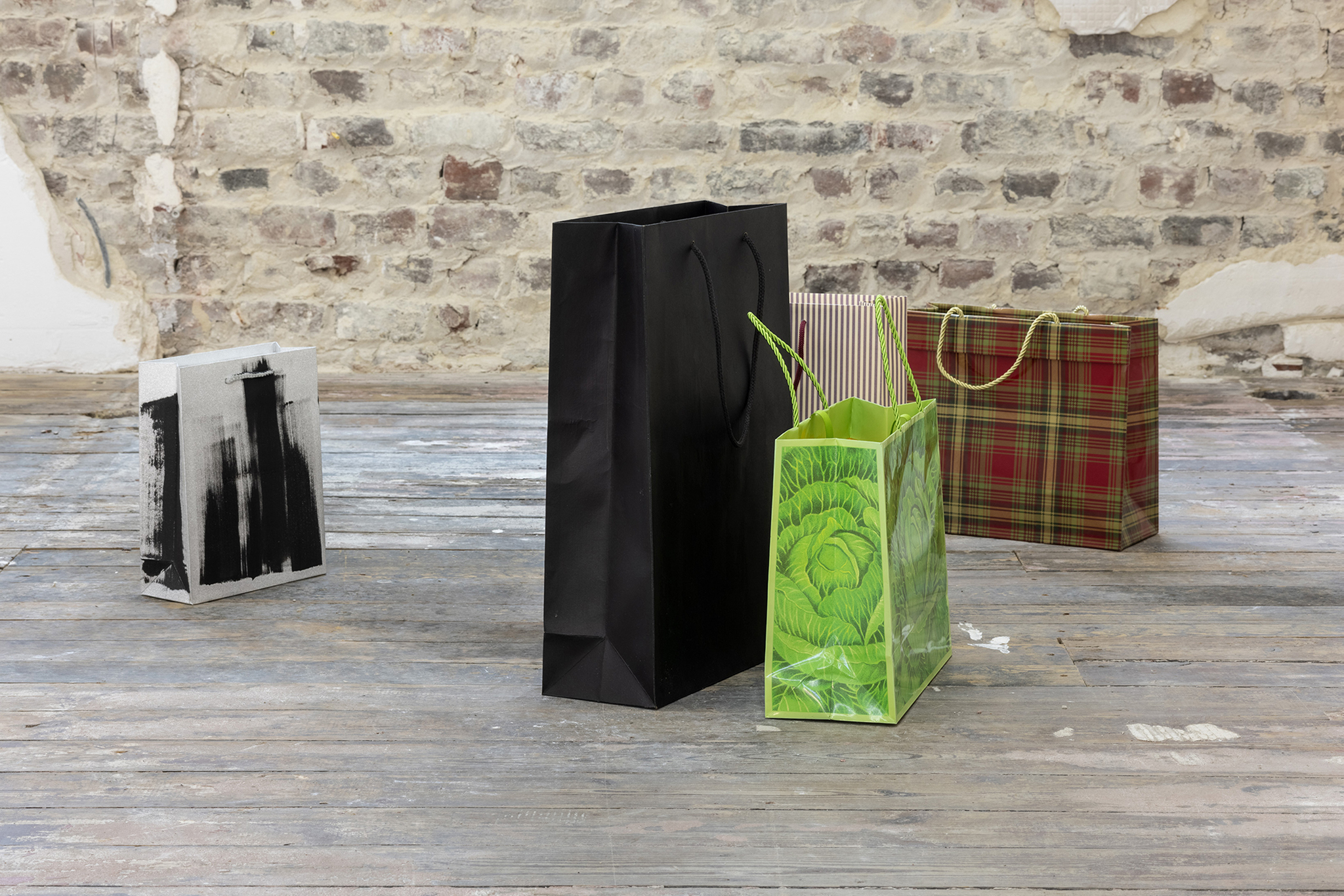 Bags, Mara Jenny, 2026. Bags, some of them painted, house facades, all painted, various dimensions. ©Fabrice Schneider