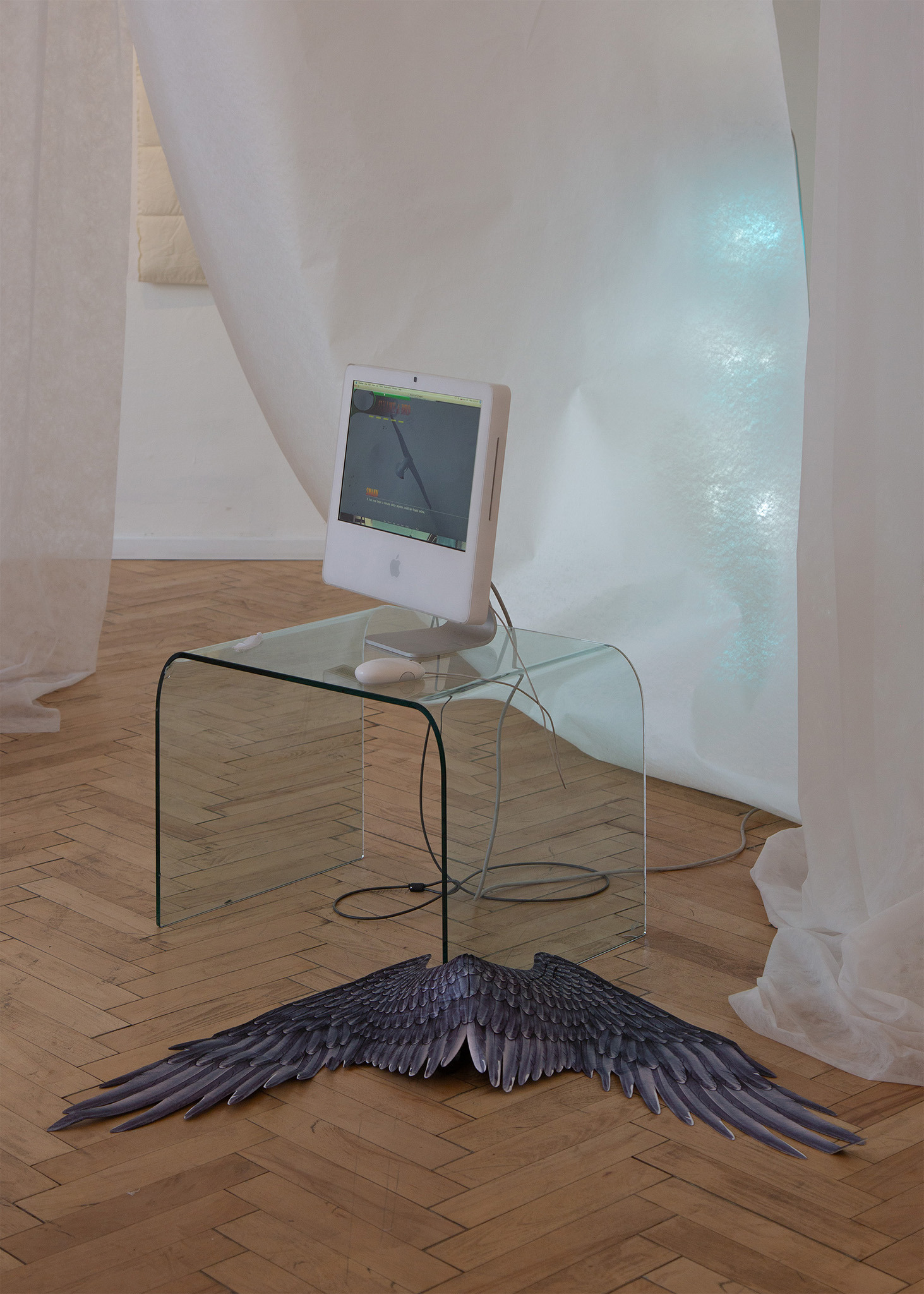 Morgane Billuart, Bad Kingdom, 2025, Digital Comic, Glass table, 2001 iMac, plastic wings  