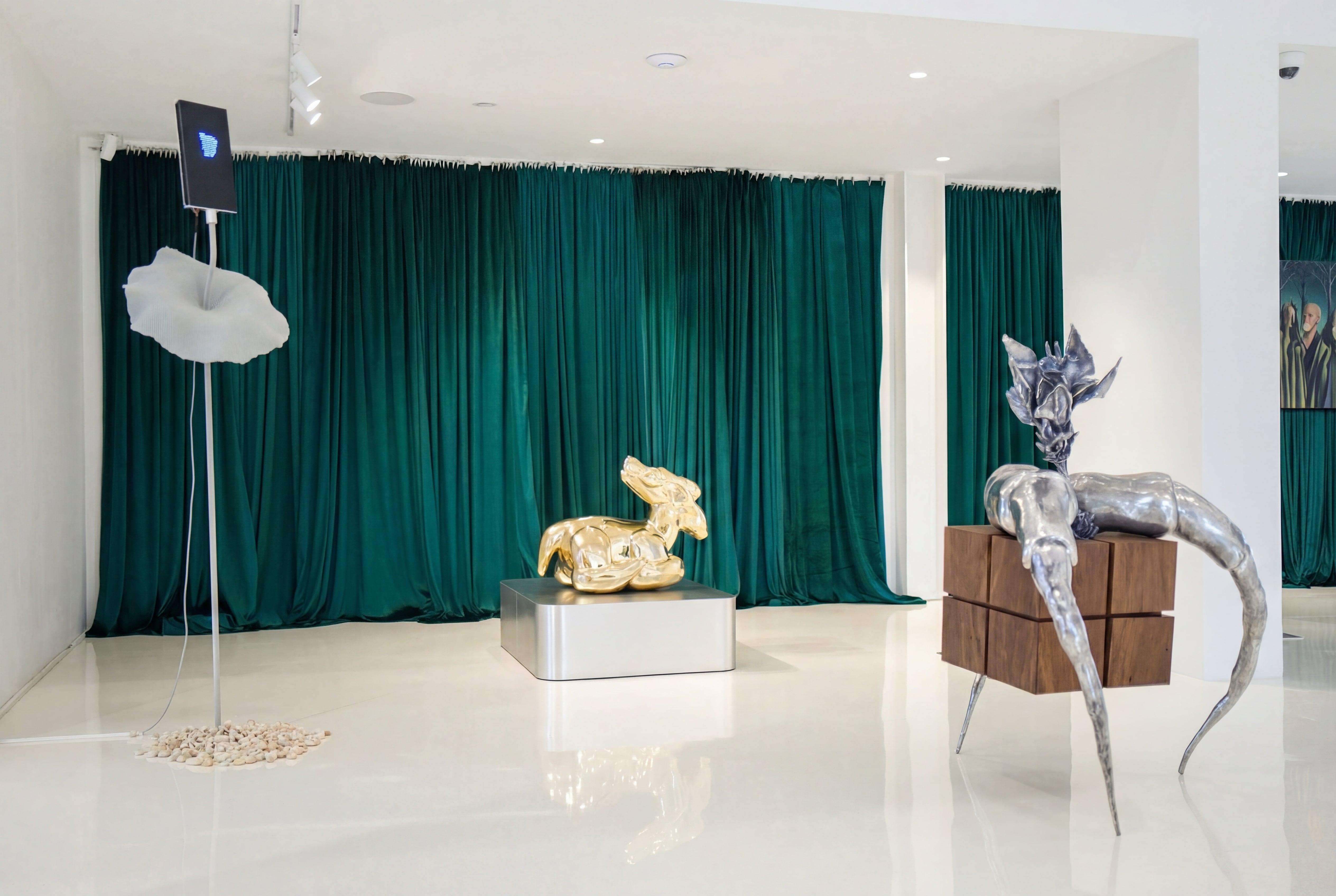 exposition. square with three legs and a flower 2026. aluminum, Chinese rosewood. 120×100×100. Dishon Yuldash.  golden deer 2026. bronze. 60×75×45. Dishon Yuldash, Swatchrokorn Wannasorn. 