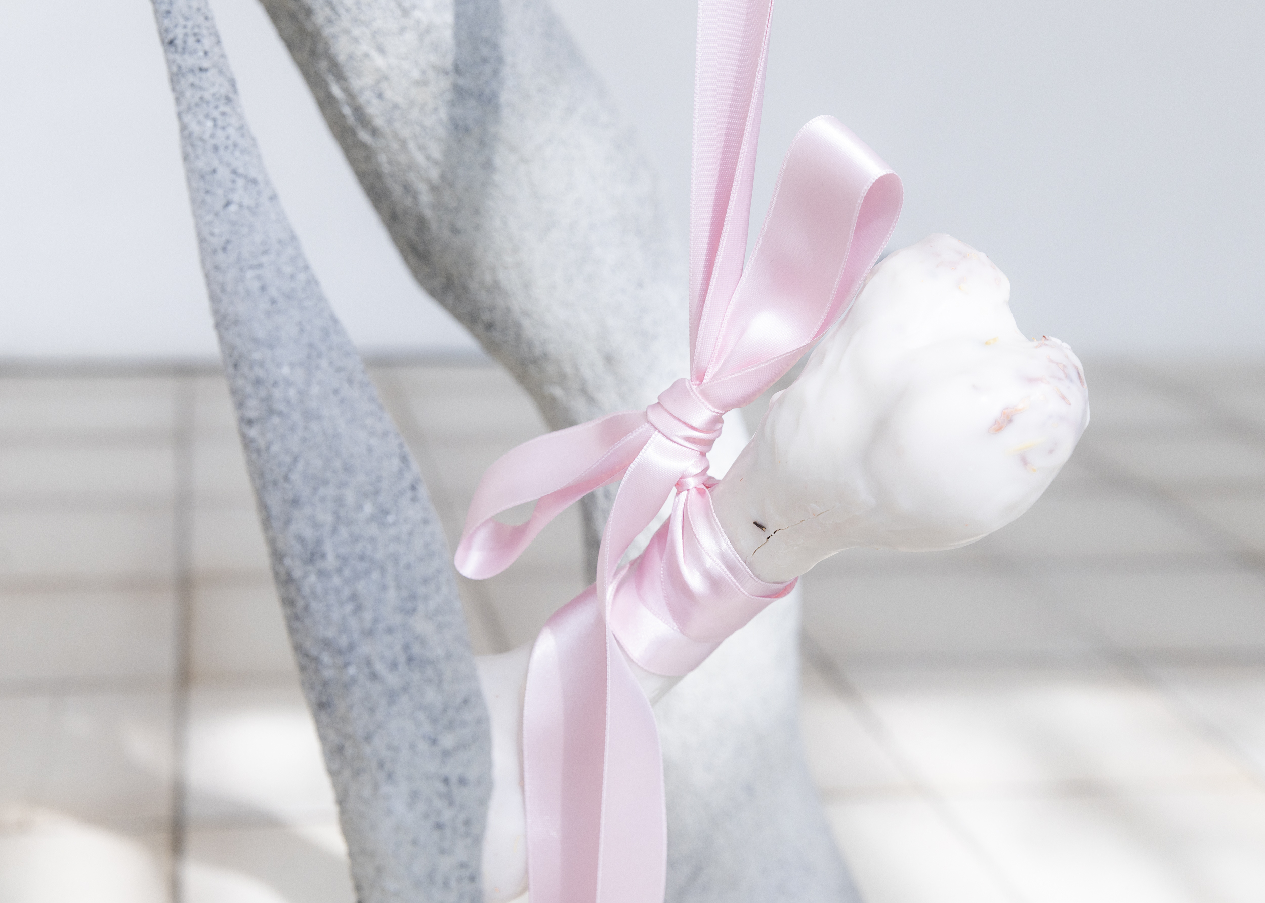 Natalija Gucheva, remnant, 2026, Animal bone, wax, 24 x 8 x 6,5 cm. rippling through by Natalija Gucheva & Julia Tröscher, 20.03 - 26.04.2026, cur. by Camille Van Meenen, at Komplot, Brussels. Image Jan Staiger