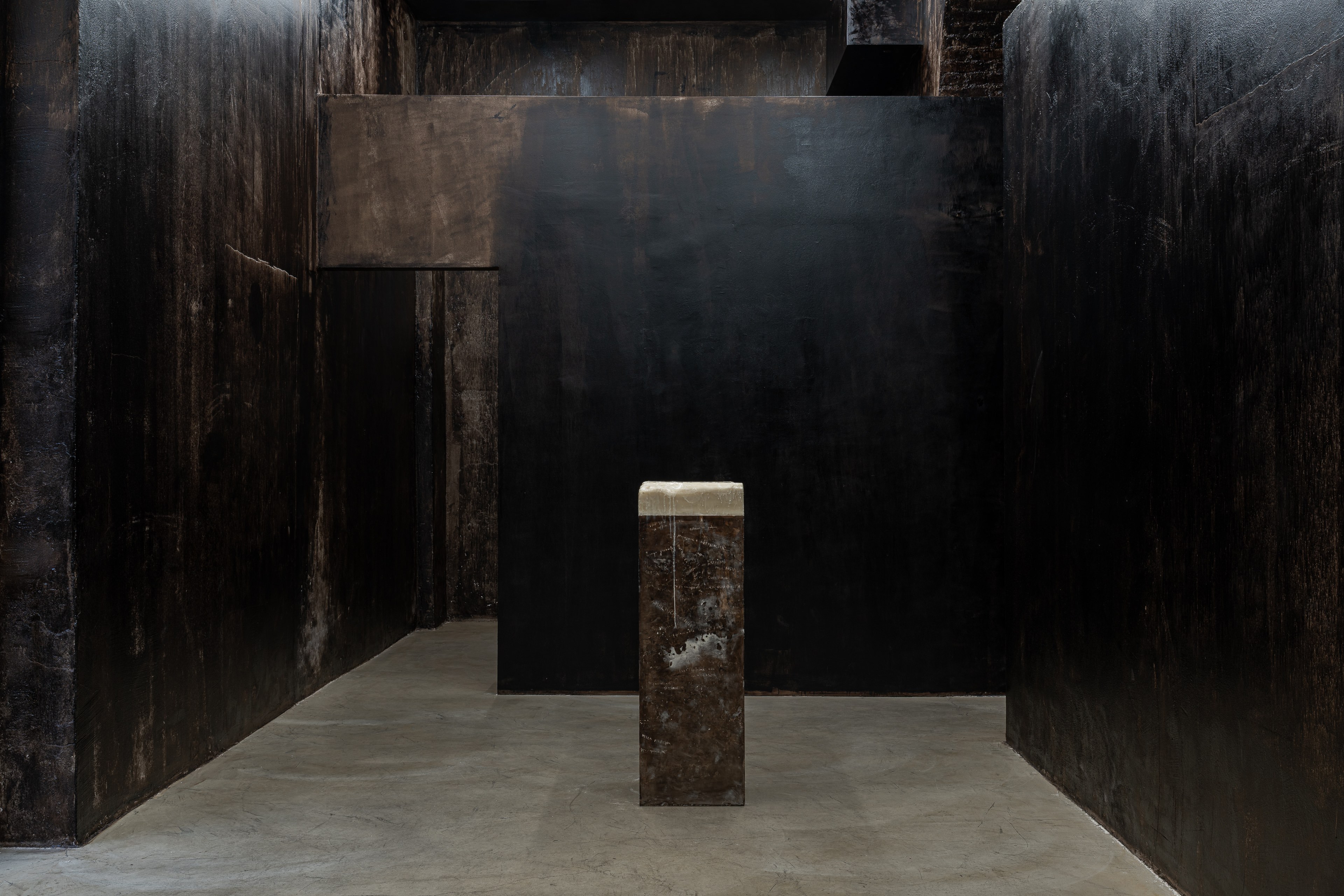 KINM010 - KINM010a - KINM010b Nicola Martini, Sippe (Alessandro, Jacopo), 2026 Microcrystalline wax, bitumen, plaster, 35 x 106 x 106 cm
