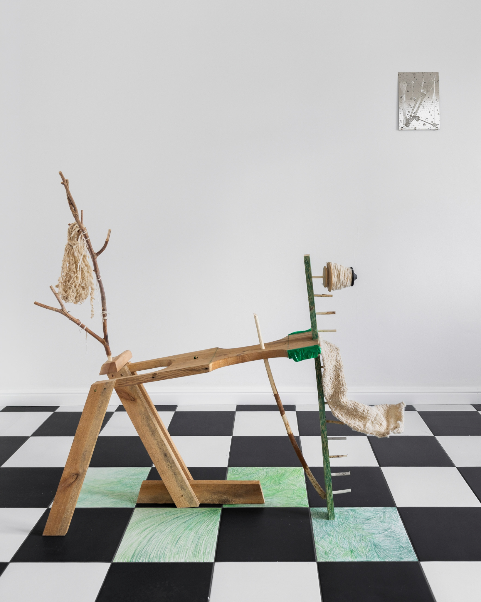 Anna Siekierska, „Transhumance”, 2025, wood, sheep wool, 80 x 60 x 40 cm, Konrad Gubała, „Until Death”, 2026, engraving and varnish on stainless steel, 21 x 30 cm, 2026