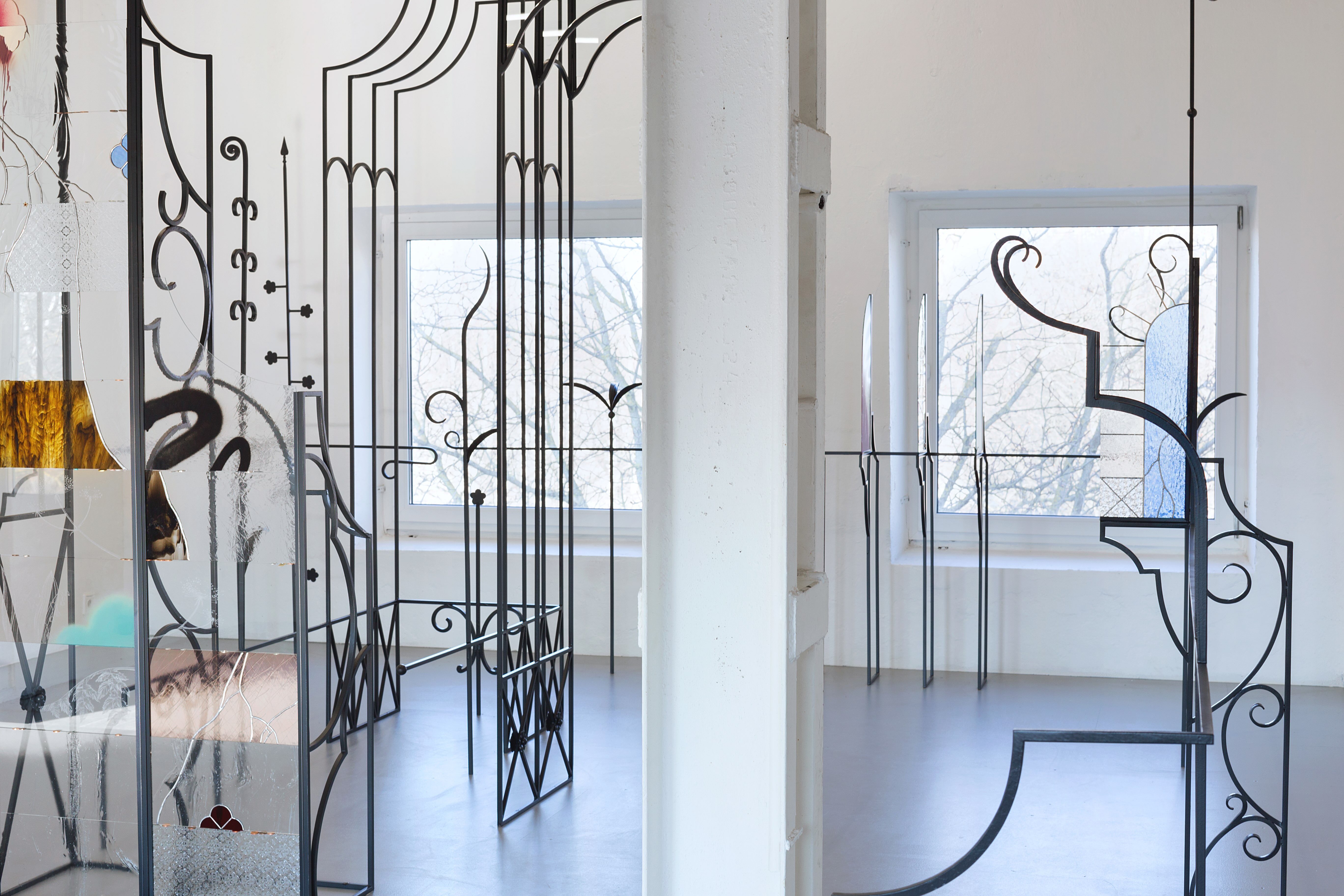 Anna Mari Liivrand, Amid Bitter Flowers, 2026. Installation (wrought iron, stained glass, antique glass, found glass, solder, spray paint, coins, buttons and ohter found objects).