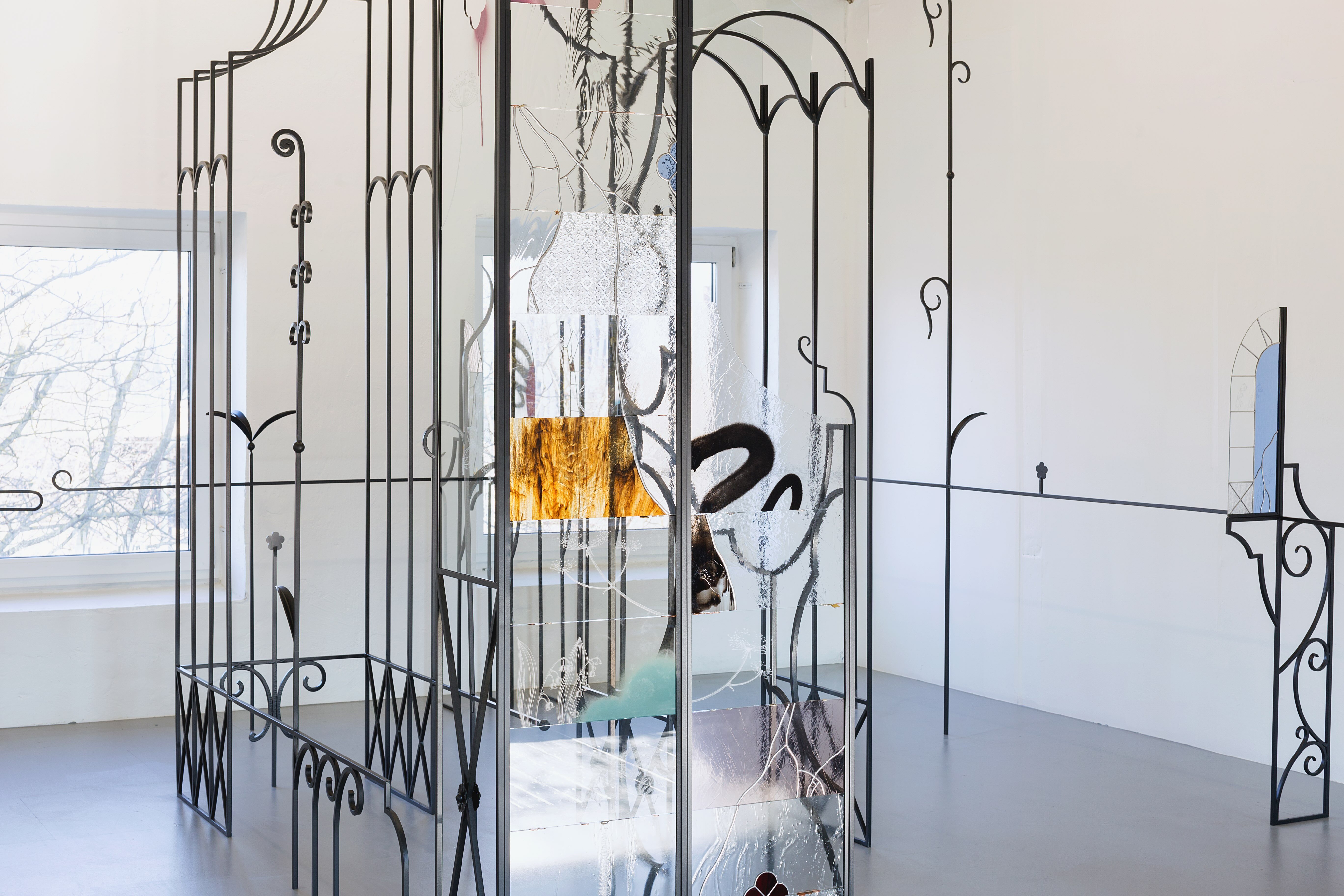 Anna Mari Liivrand, Amid Bitter Flowers, 2026. Installation (wrought iron, stained glass, antique glass, found glass, solder, spray paint, coins, buttons and ohter found objects).