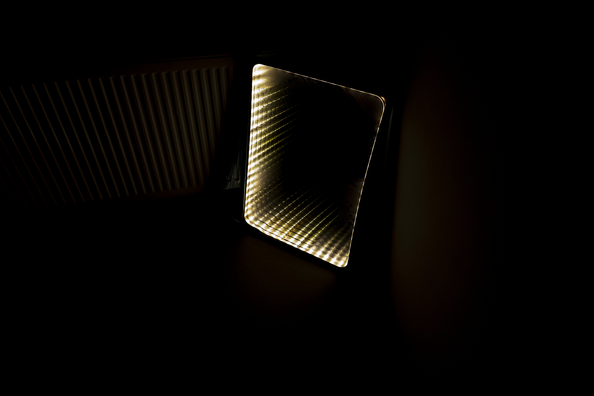 Principle of Asignifying Rupture, installation: one-way mirror, LED strips, UV print,  50 x 70 cm, 2026