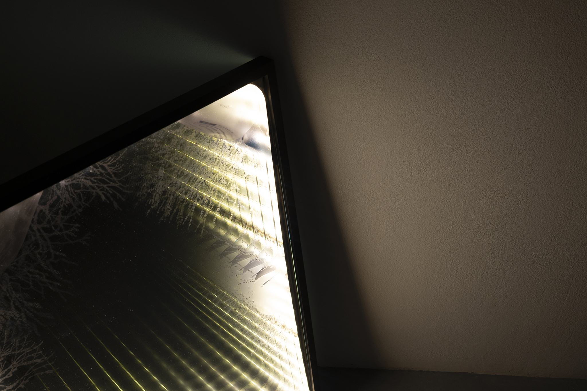 Principle of Asignifying Rupture, installation: one-way mirror, LED strips, UV print,  50 x 70 cm, 2026 – detail