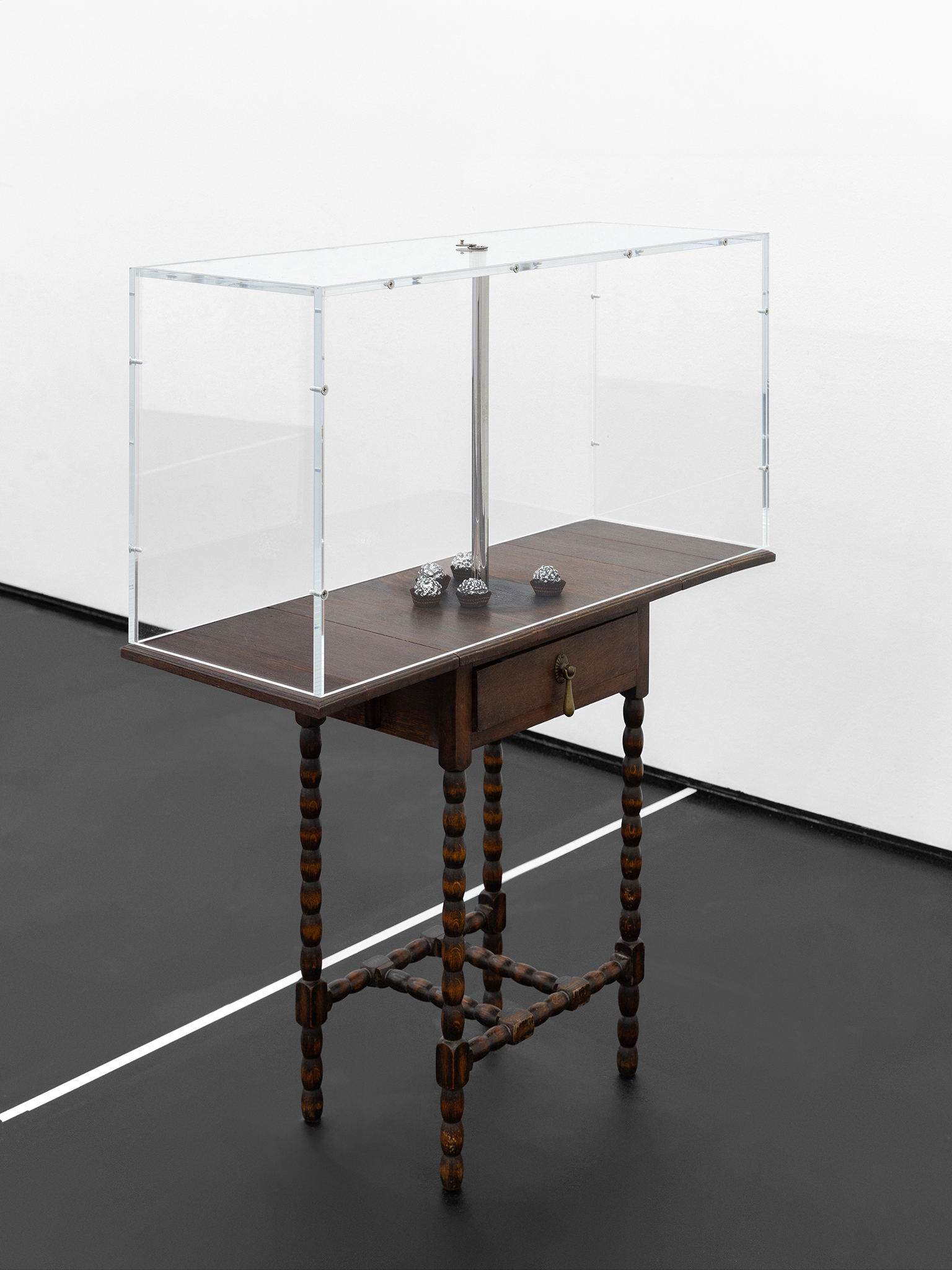 I No Longer Need to Hide Chocolate…, 2026, Artist-used 1900s furniture, polished cast aluminum, acrylic box, polished stainless steel, inkjet print, LED, and door viewer, 100 × 85 × 32 cm, ©Julie Becquart
