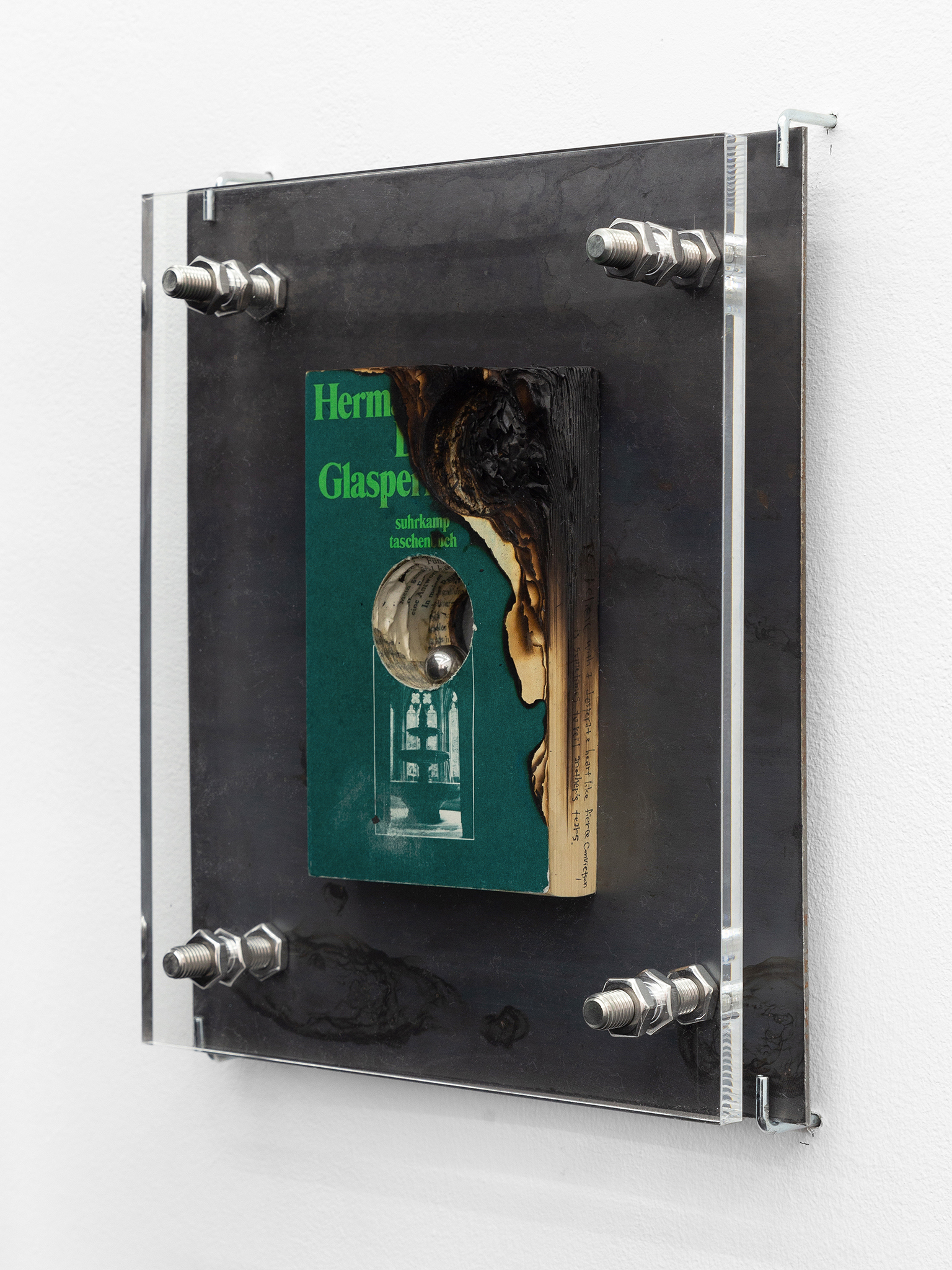  I love you. I will become me (Glass bead game and Demian by Hermann Hesse), 2026, Acrylic glass, hand-polished steel, stainless steel, books, 32 × 27 × 7 cm, ©Julie Becquart