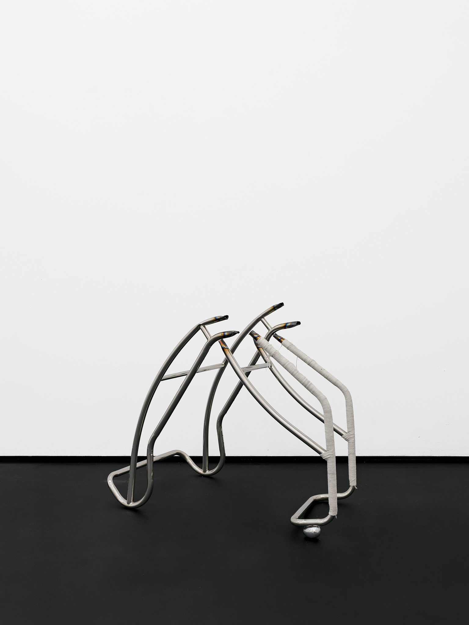 You, old and broken of limb, shall not break my world , 2026, Artist-made LC4 chair, stainless steel frame. cotton cord, polished cast aluminium, 85 × 90 × 74 cm, ©StudioShinohNam