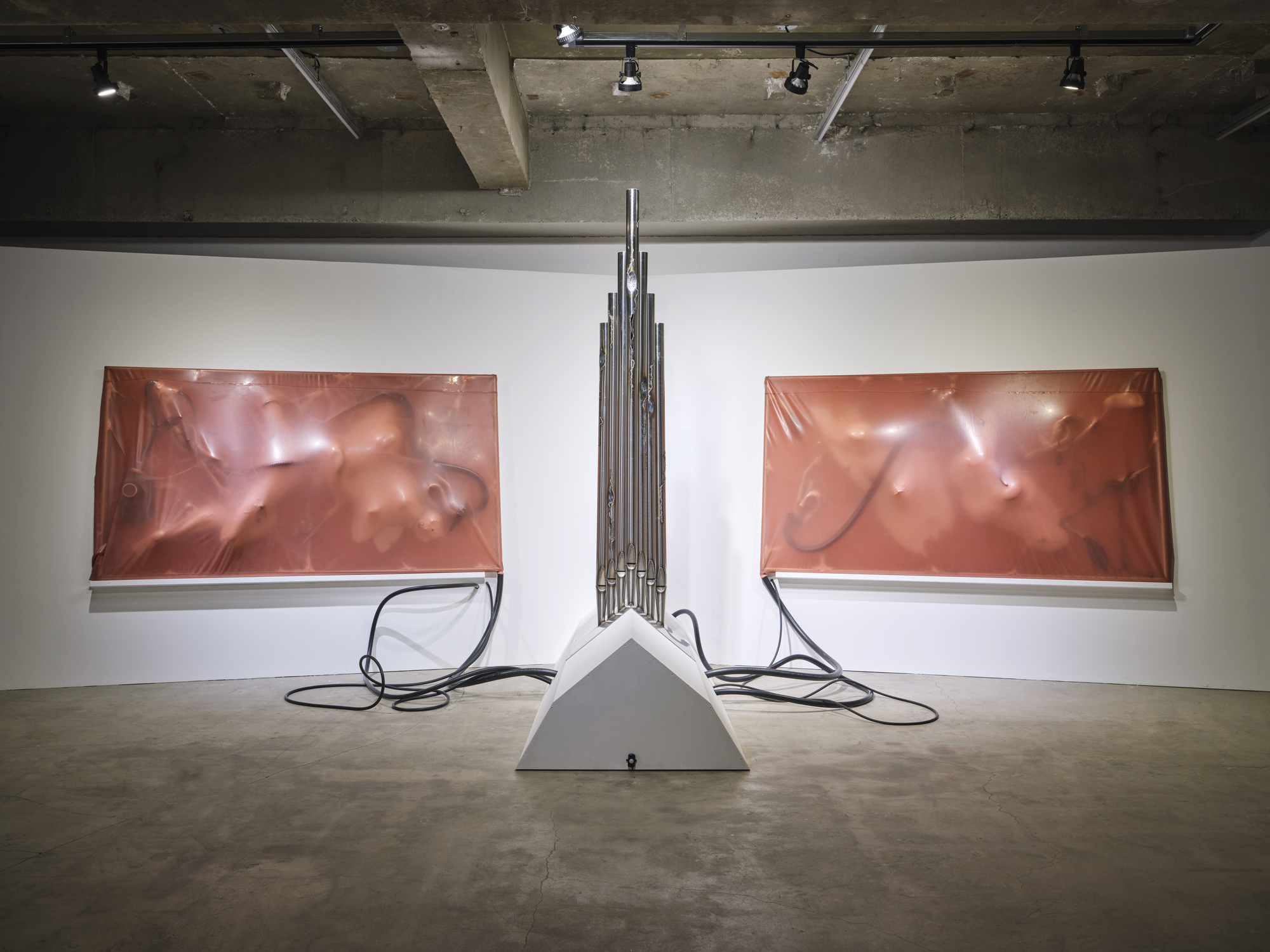 When All Flesh Turns to Light, 2026, Stainless steel, latex, vacuum cleaner, sensor timer, CNC-machined styrofoam, sex toy, mixed media, dimensions variable