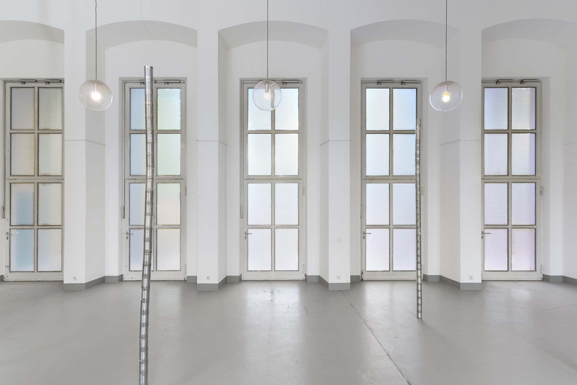 Fabian Raphael Sokolowski, Zwischenwerte, 2026, buttermilk, soy yogurt and food colouring on glass, site specific installation, 30m wide