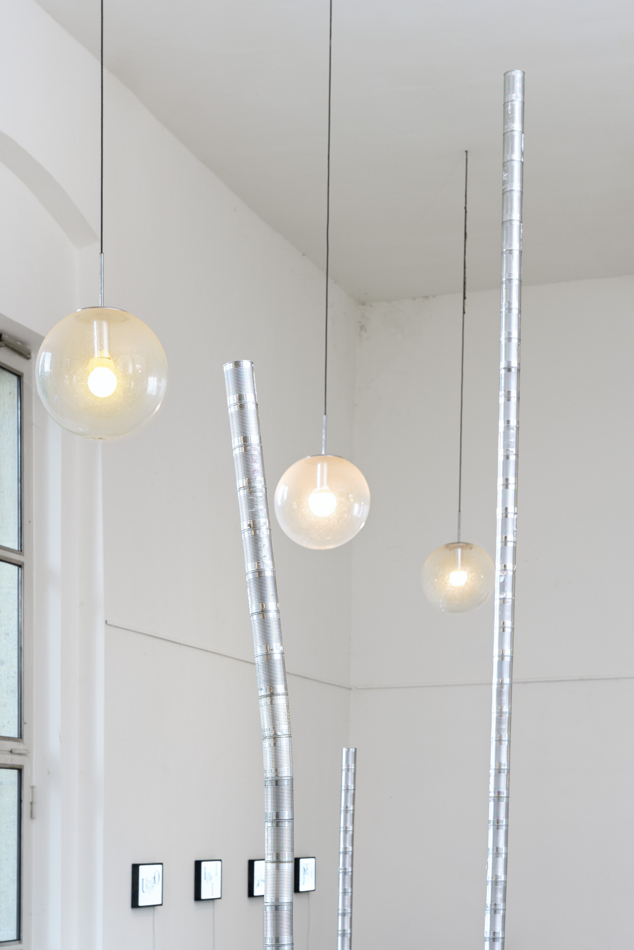 Paula Rinderle, Champs, 2026, cans, tape, variable dimensions