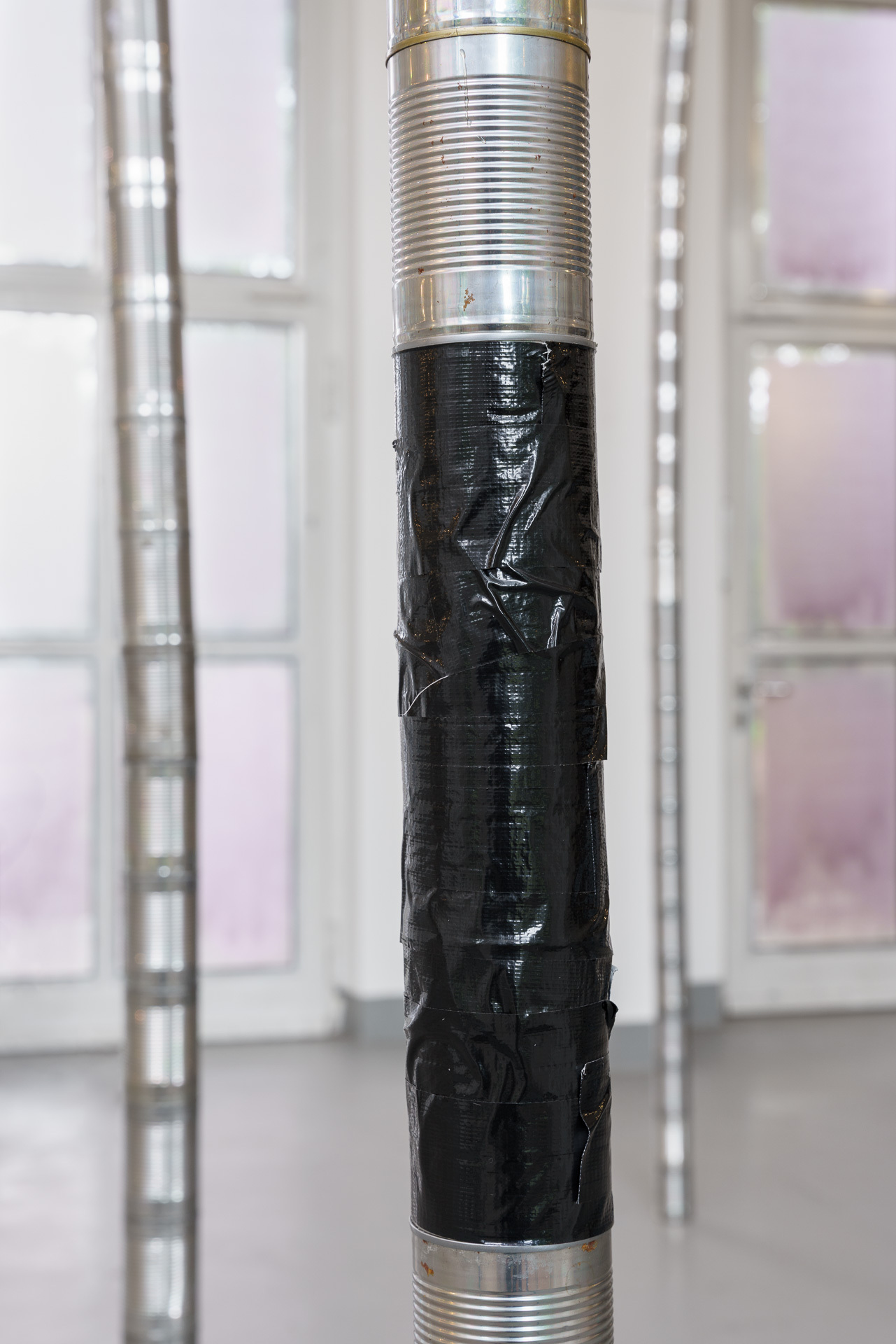 Paula Rinderle, Champs, 2026, cans, tape, variable dimensions