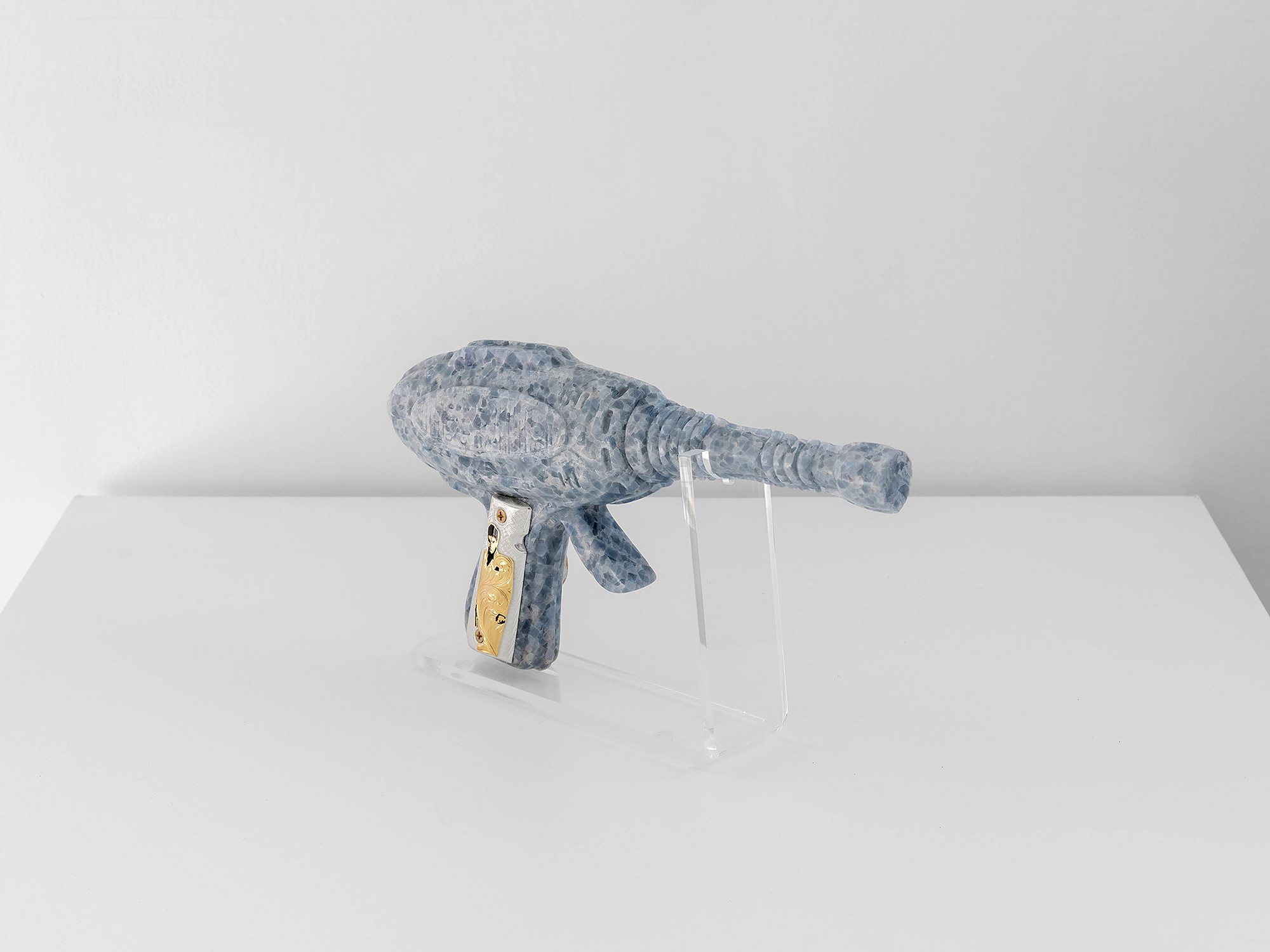 THE UNIVERSE IS YOURS, 2026, Blue calcite, custom gun grips Colt 9mm, 36 x 7 x 21 cm