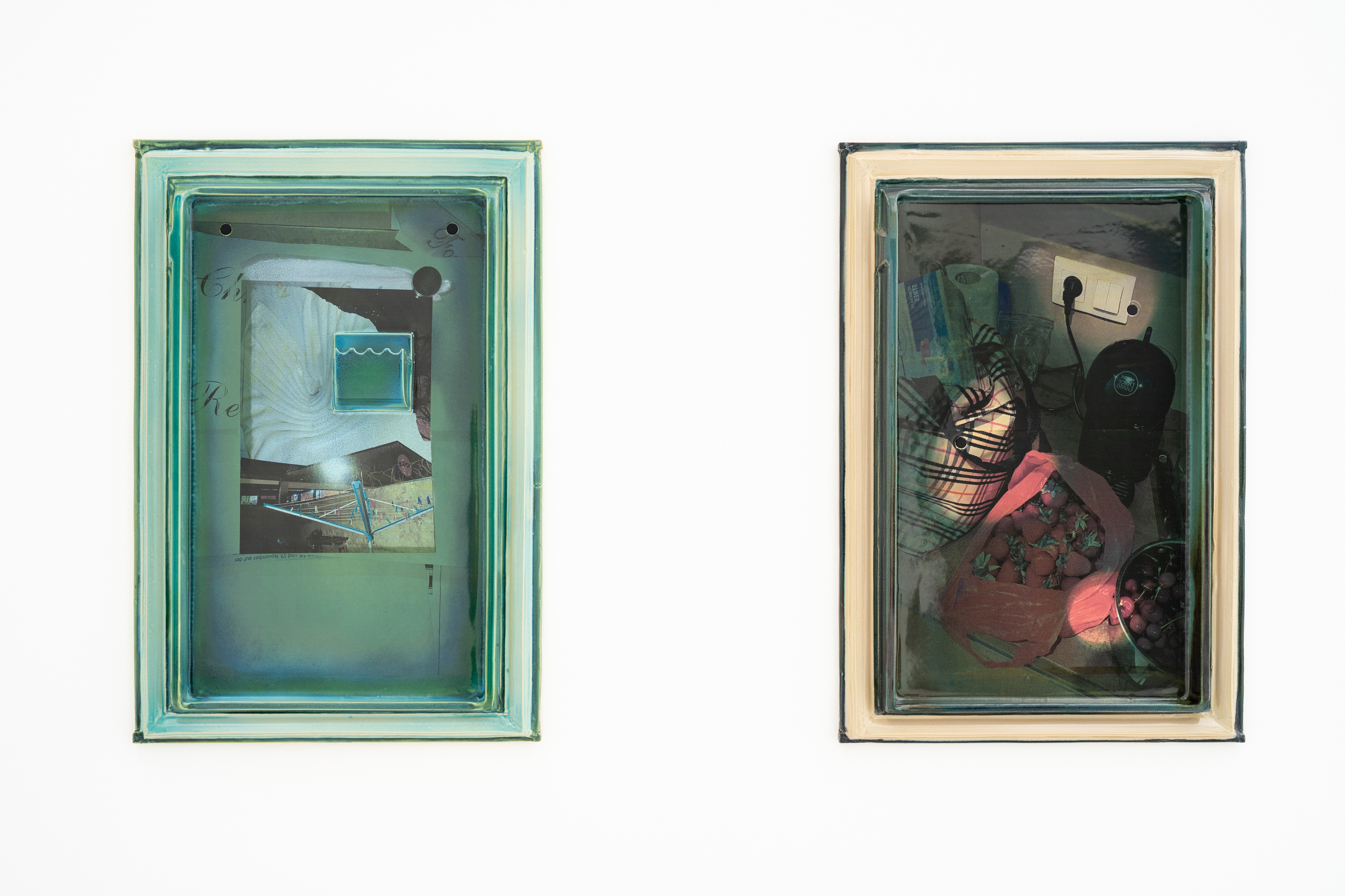 Installation view of Single Fridge (Fan Fold) (2025) and Single Fridge (Counter Communion) (2025), Kunstraum Remise, Bludenz, 2026. 70 x 48 x 7 cm and 70 x 48 x 5 cm. Glazed ceramic. Courtesy of Kunstraum Remise and the artist.