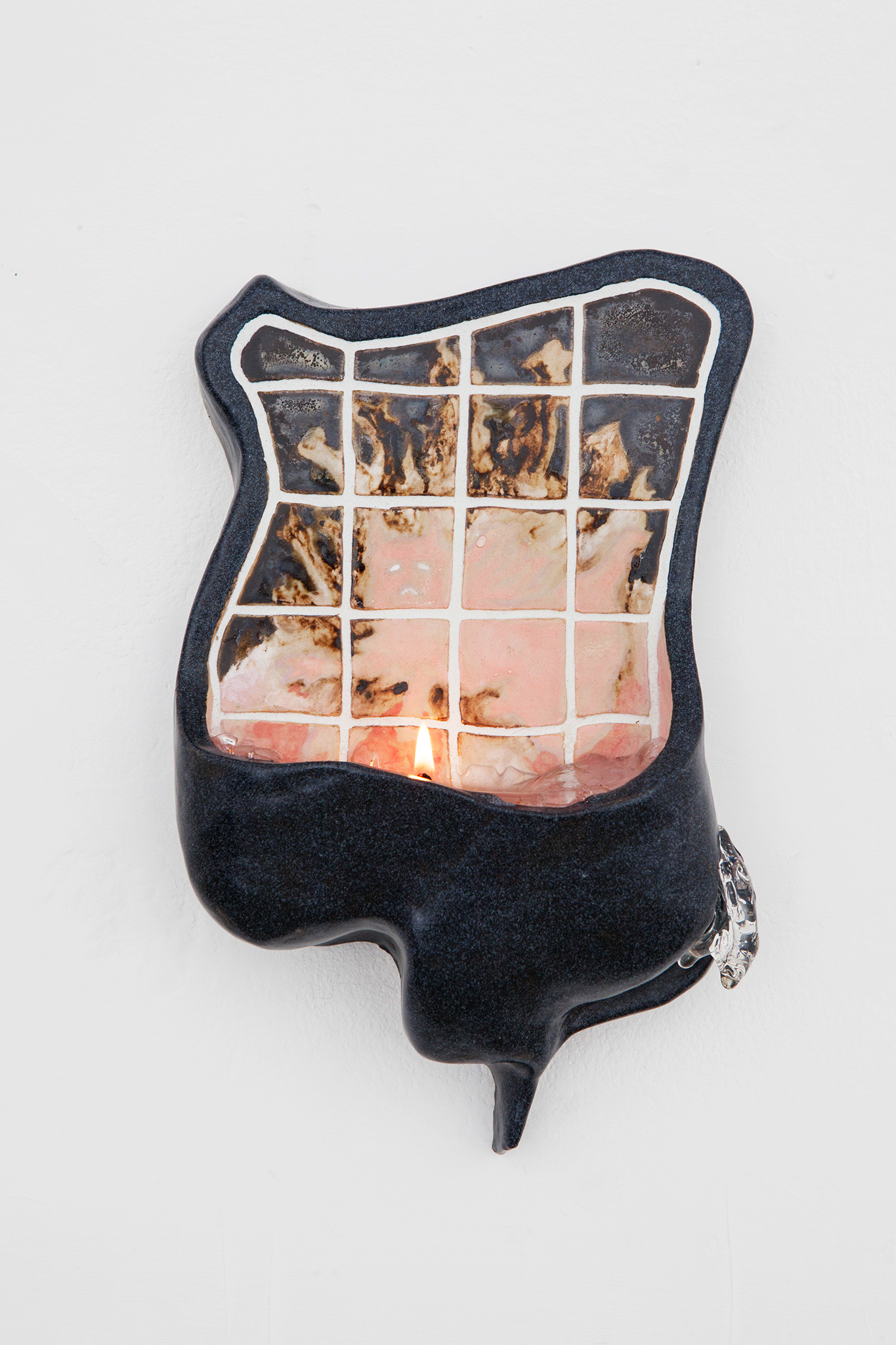 puny self, 2026, underglaze paint, glazed stoneware, grout, jelly wax candle, 25 x 15 x 5 cm