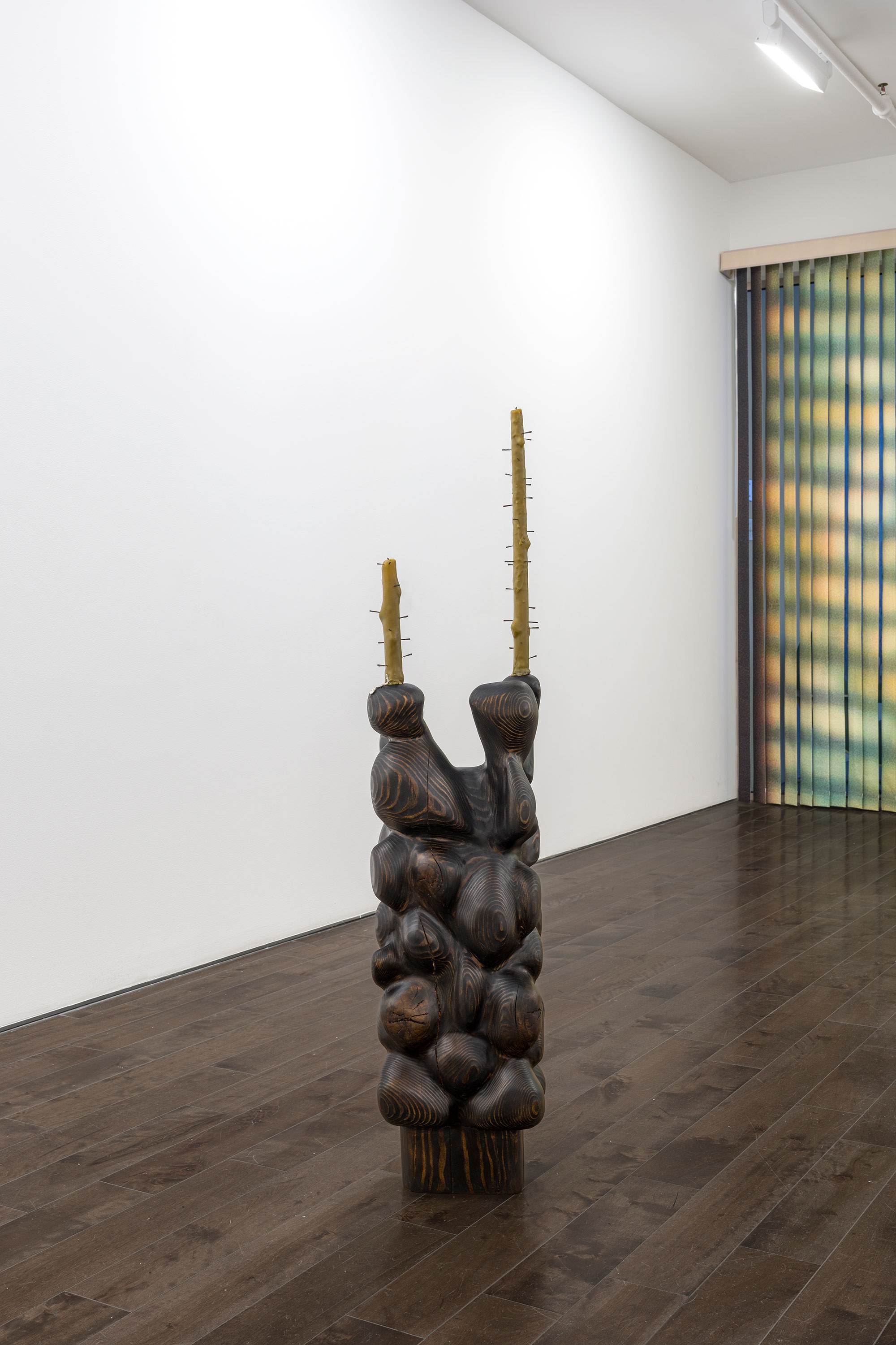 Anne Dahl, 2026, (long pause), Reclaimed fir beam, charcoal, beeswax, collected framers nails, white bronze, 50 x 10.5 x 7 in.