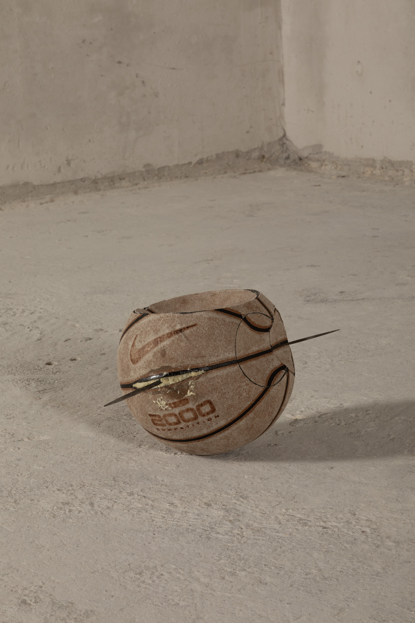 Michael E. Smith, Untitled, 2025, Basketball, wire, stuffing, foam, 20 × 24 × 20 cm.